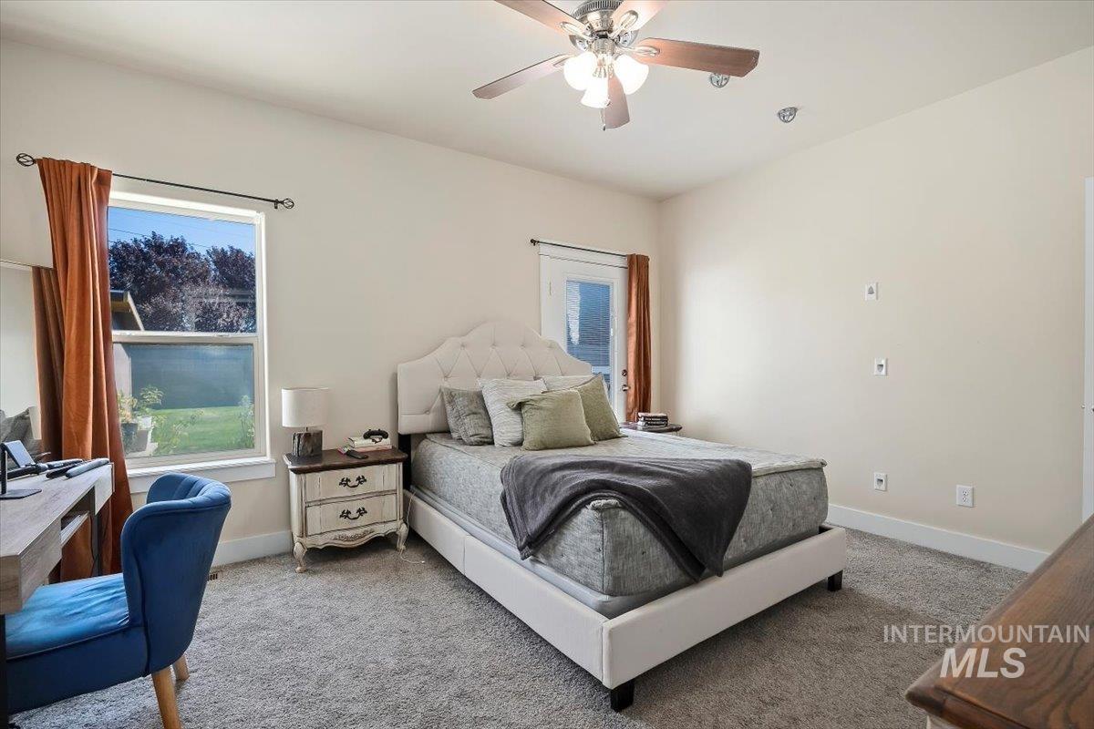 Bedroom featuring carpet and ceiling fan