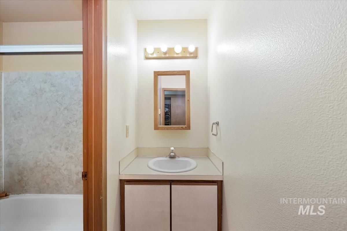 Full bath featuring vanity