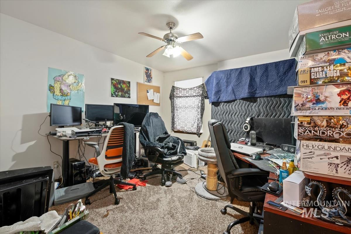 Office featuring carpet floors and ceiling fan