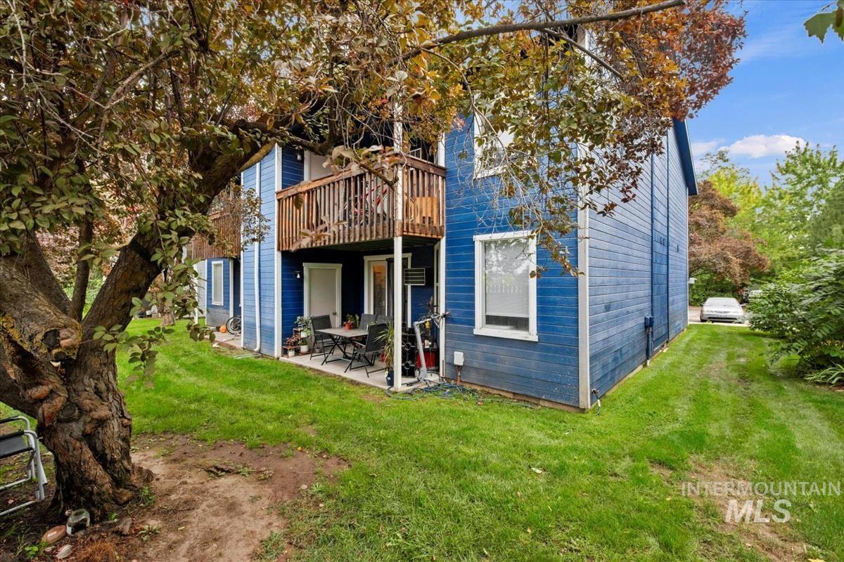 Back of house featuring a yard, a patio area, and a deck