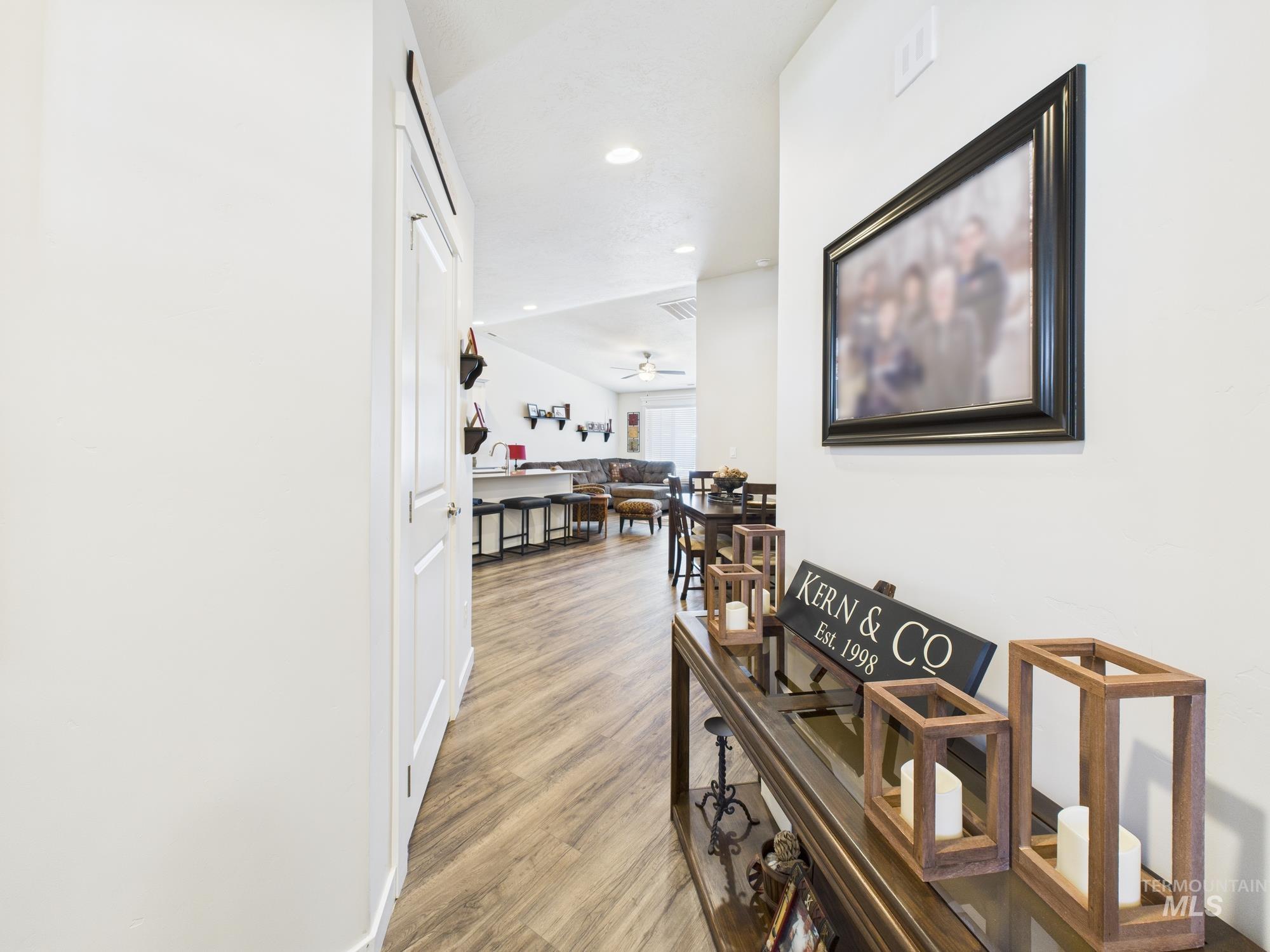 Hallway featuring recessed lighting and light wood-style floors