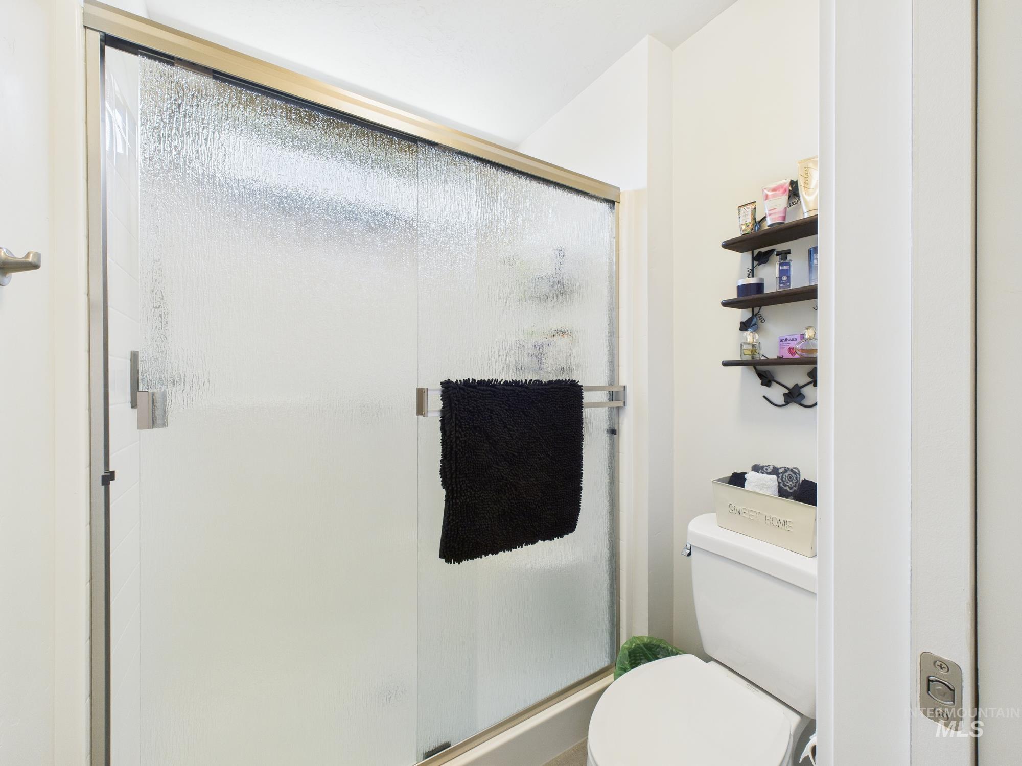 Bathroom featuring a shower stall