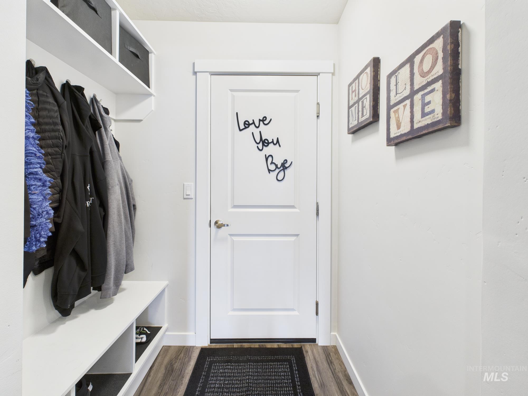Mudroom featuring dark wood-type flooring