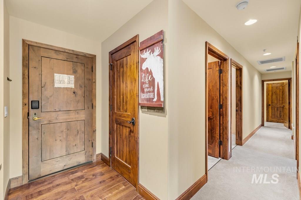 Foyer entrance with baseboards and light wood finished floors