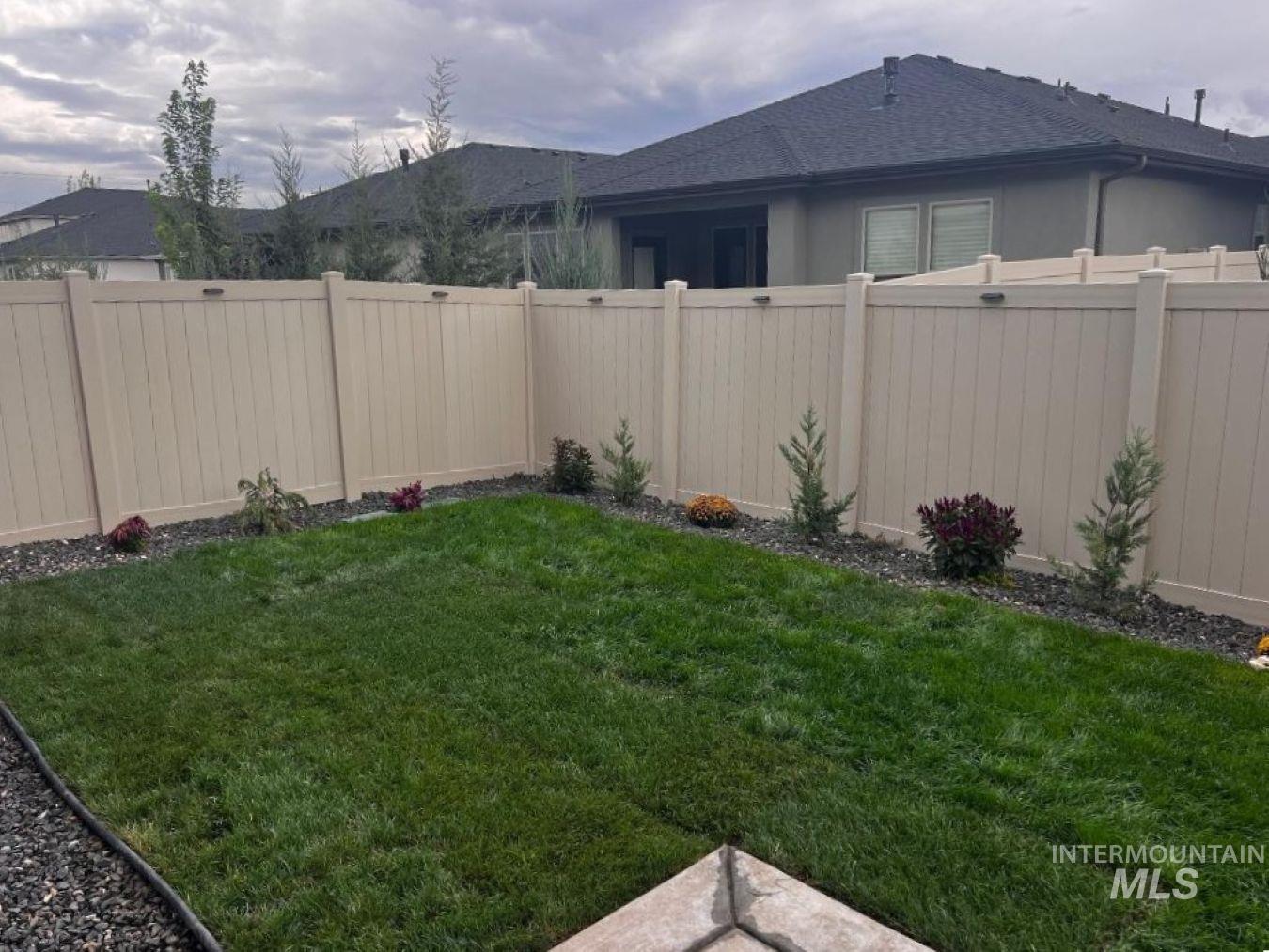 View of fenced backyard