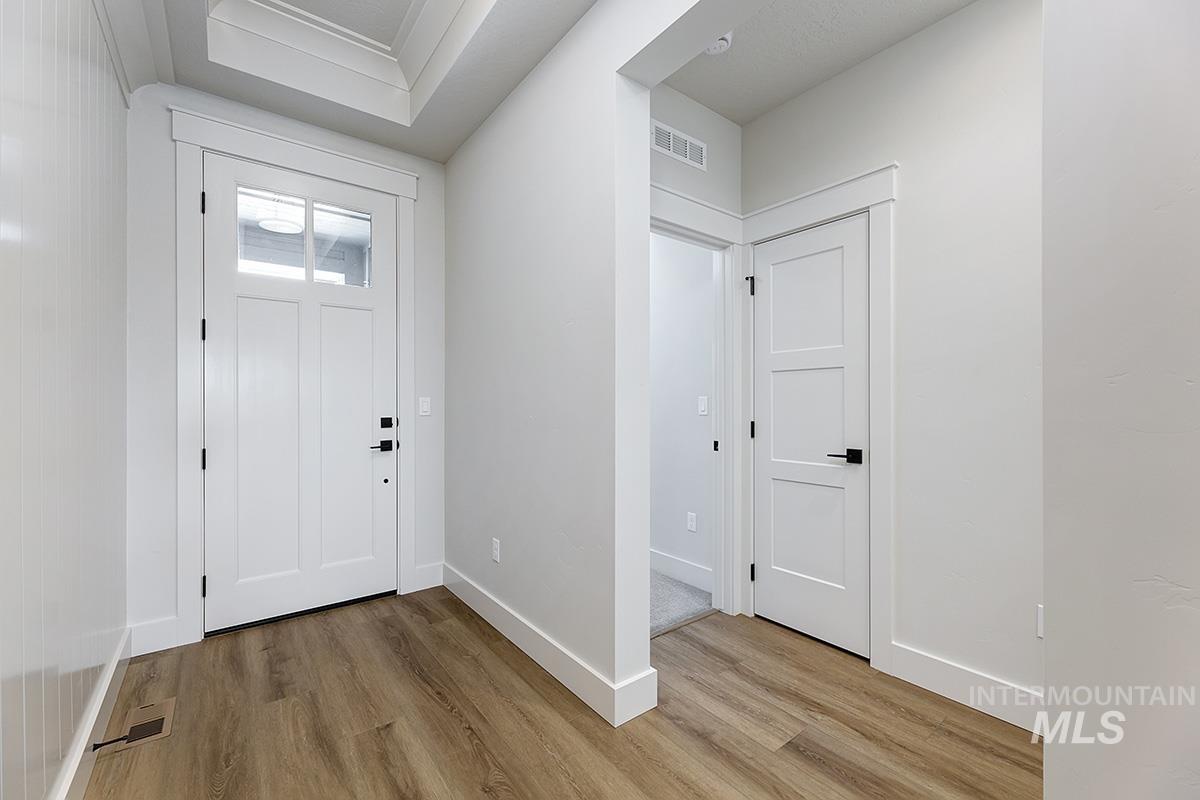 Foyer with light wood finished floors