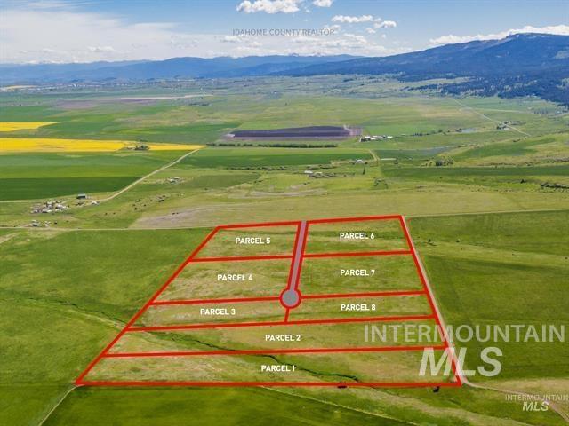 Aerial view of sparsely populated area with property parcel outlined