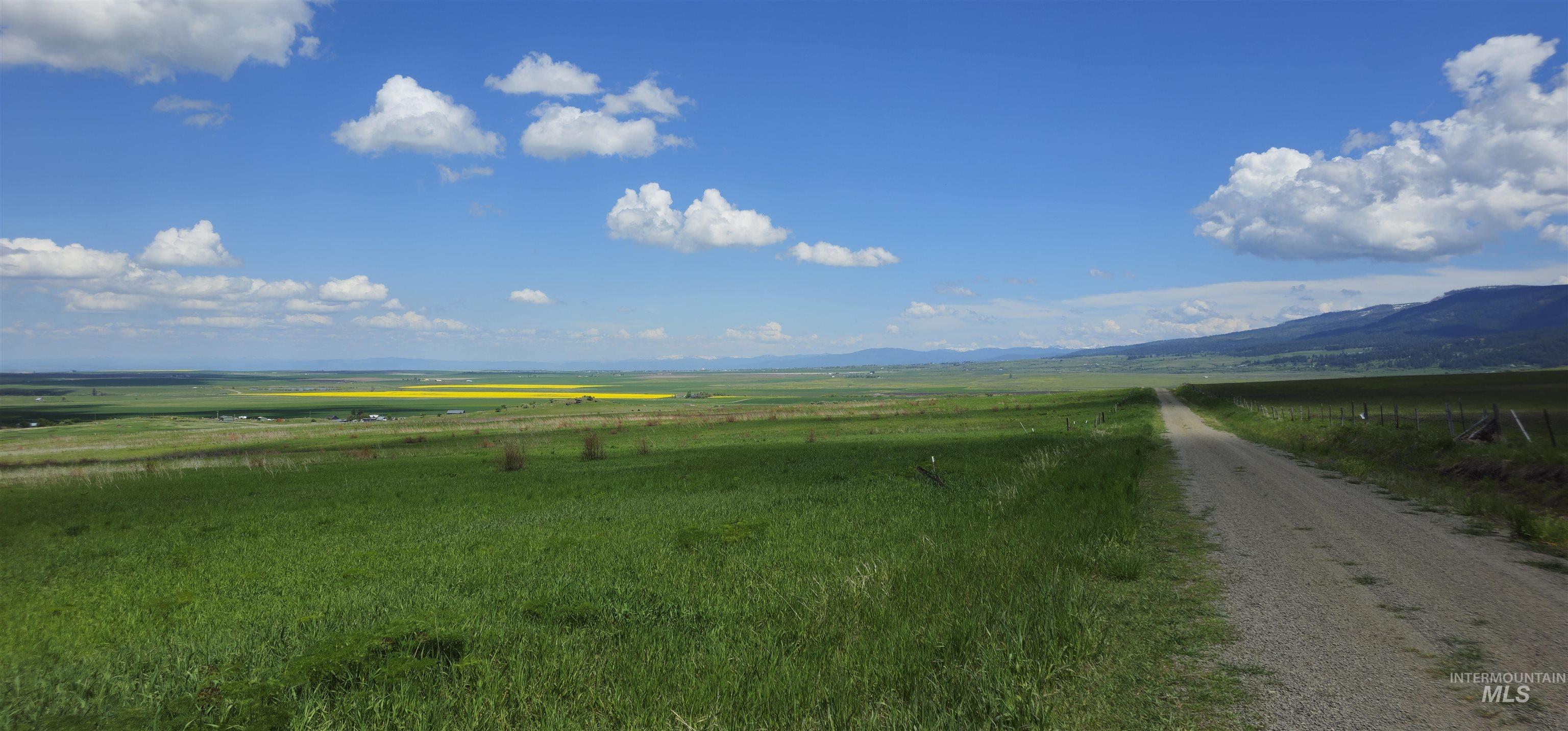 View of mountain backdrop with rural landscape