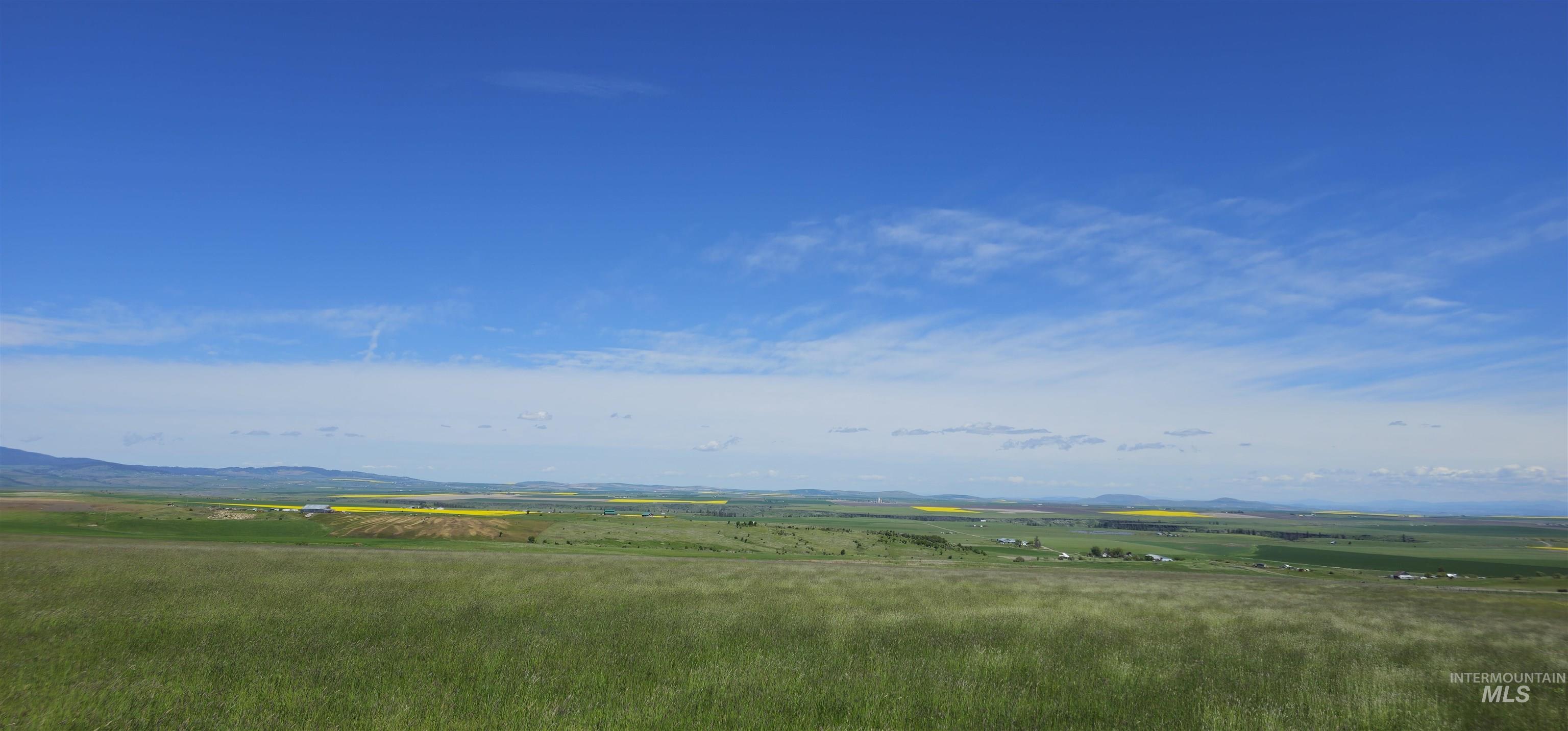 View of mountain backdrop featuring rural landscape