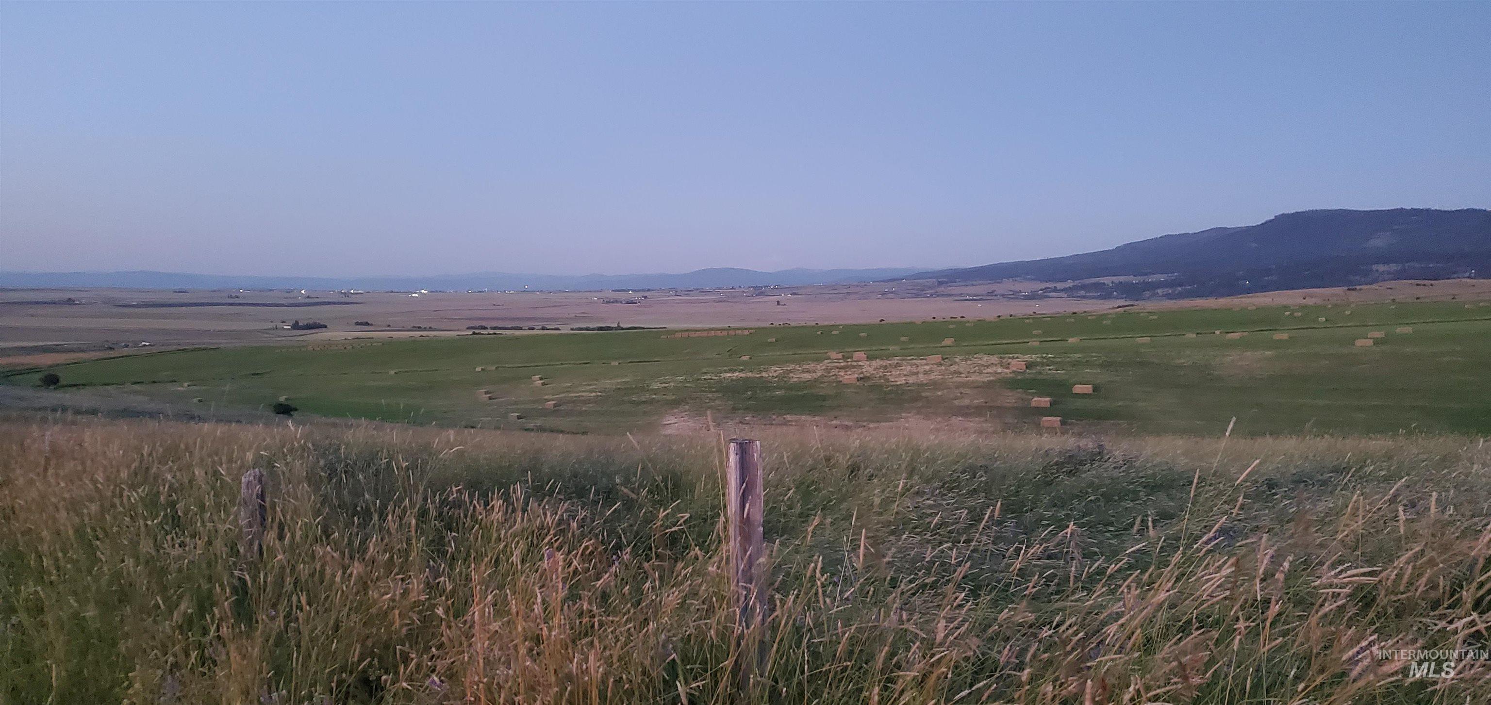 View of mountain backdrop with rural landscape
