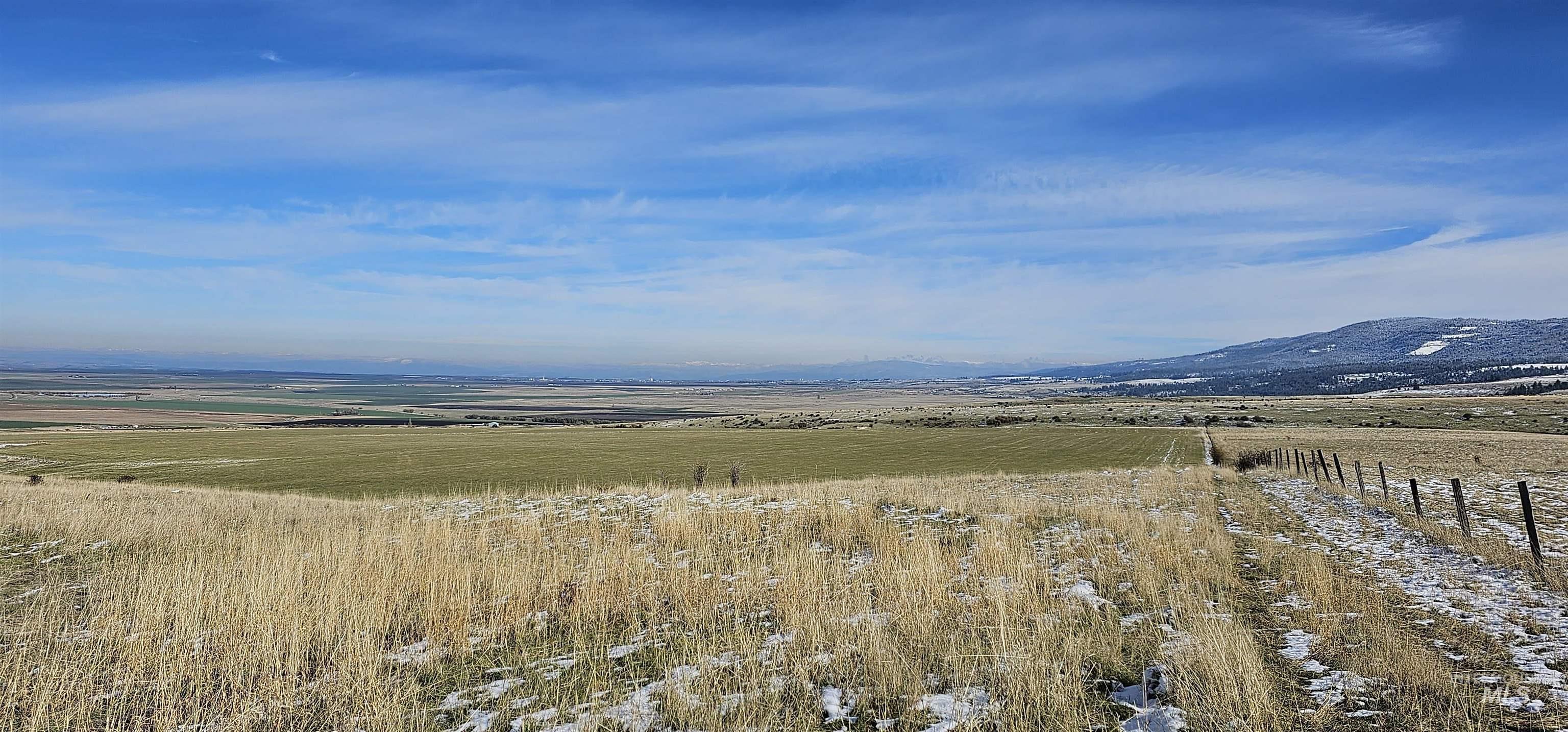 View of mountain background featuring rural landscape
