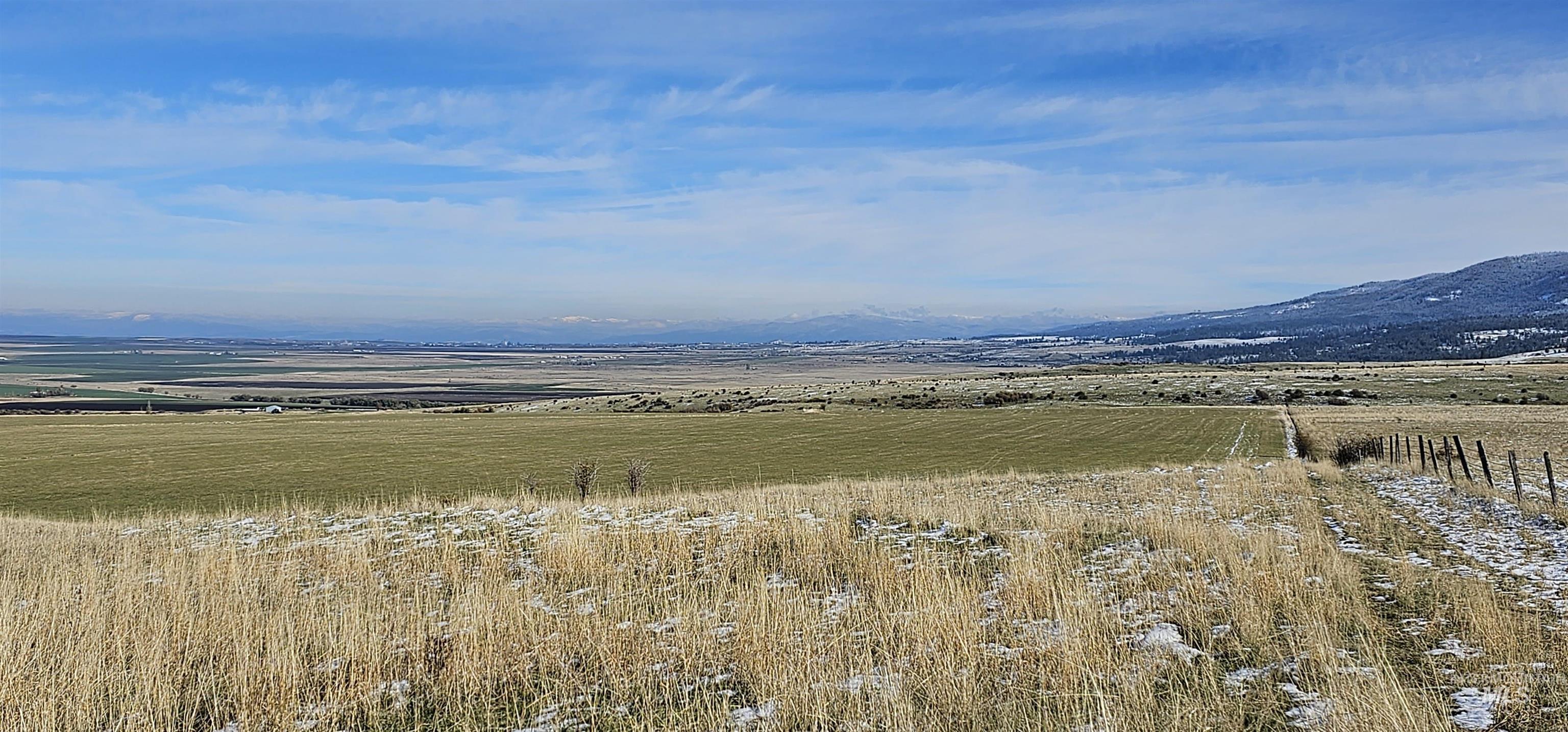 Overview of rural landscape with a mountain backdrop