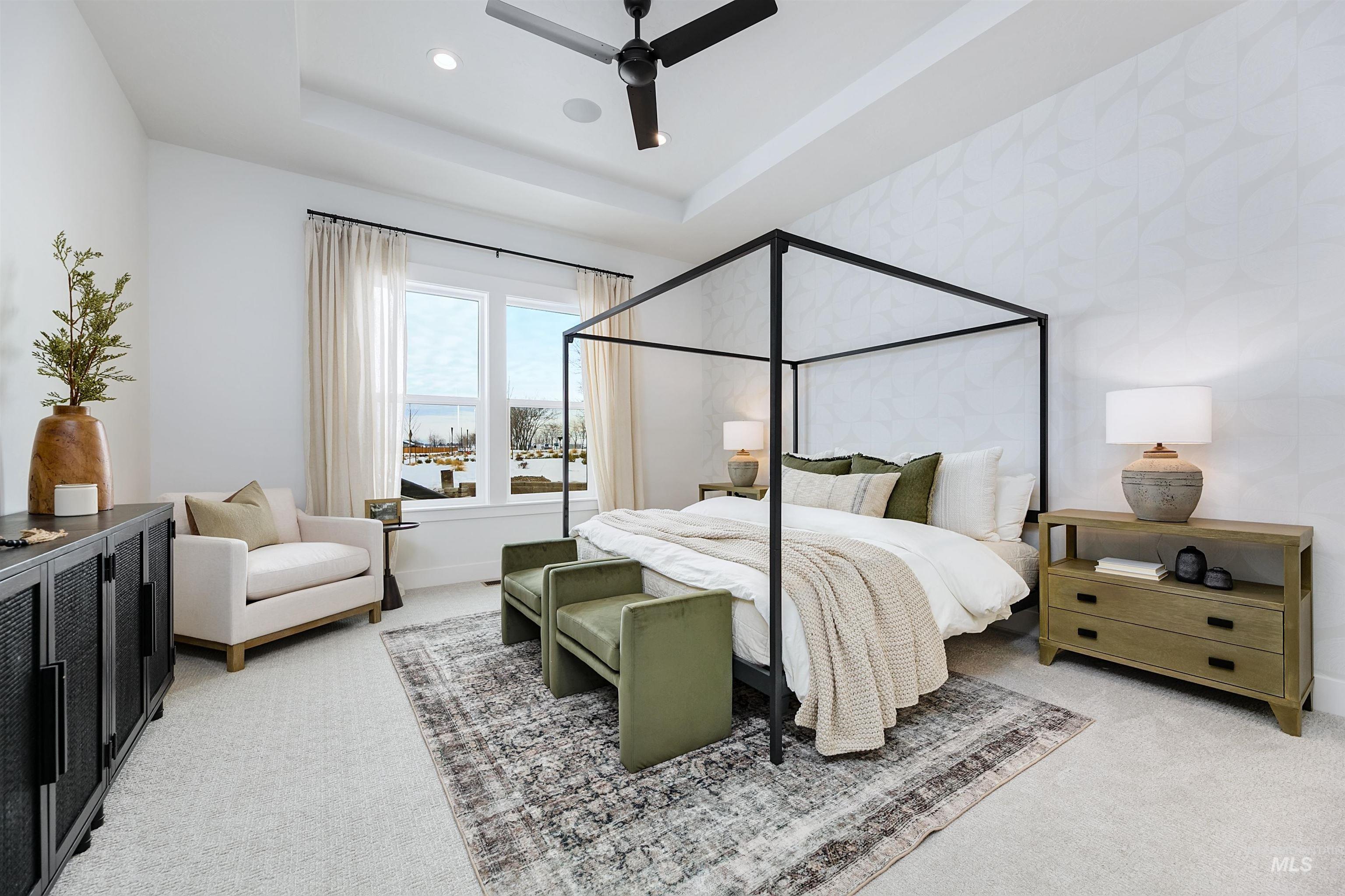 Bedroom featuring a raised ceiling, light colored carpet, a ceiling fan, and recessed lighting