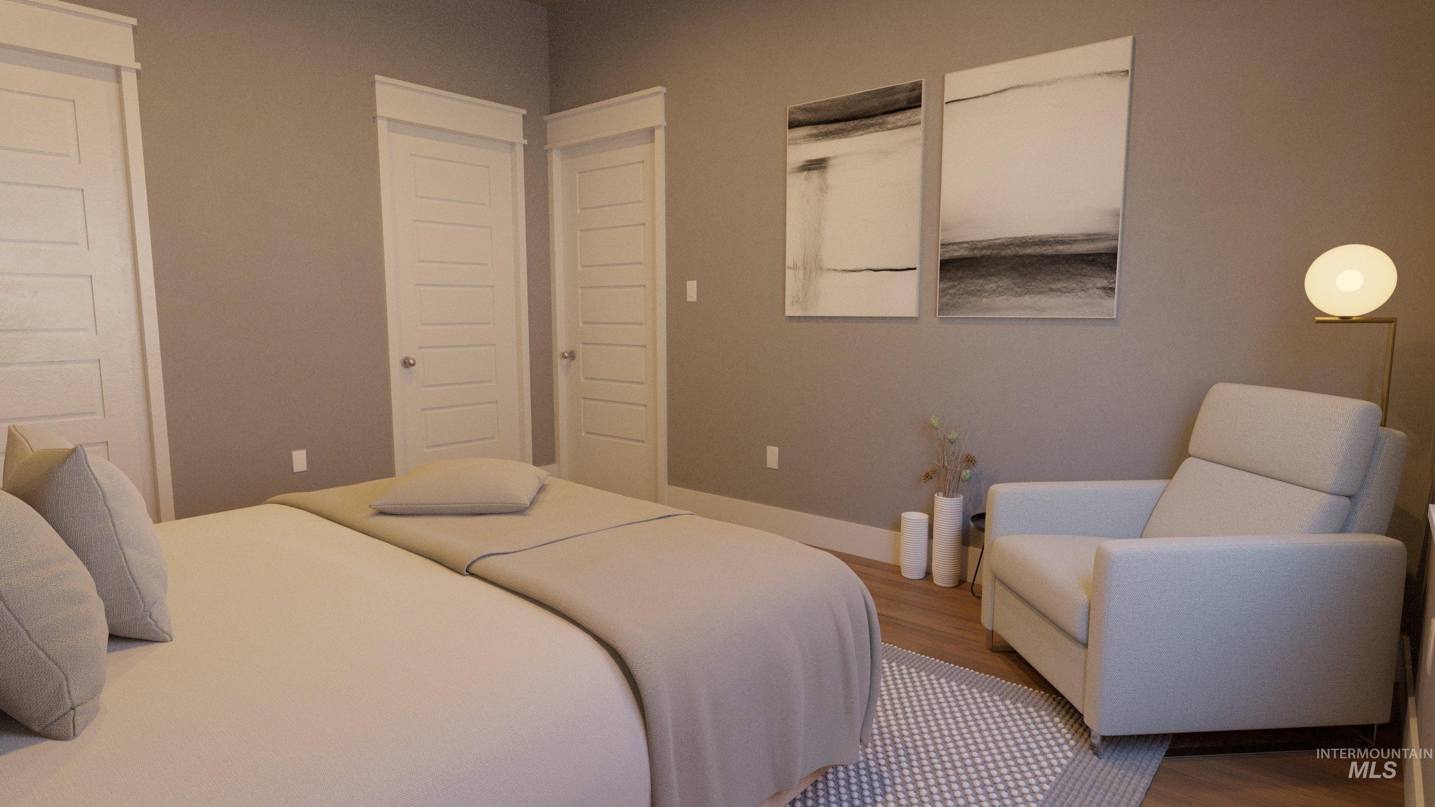 Bedroom with wood finished floors and a closet