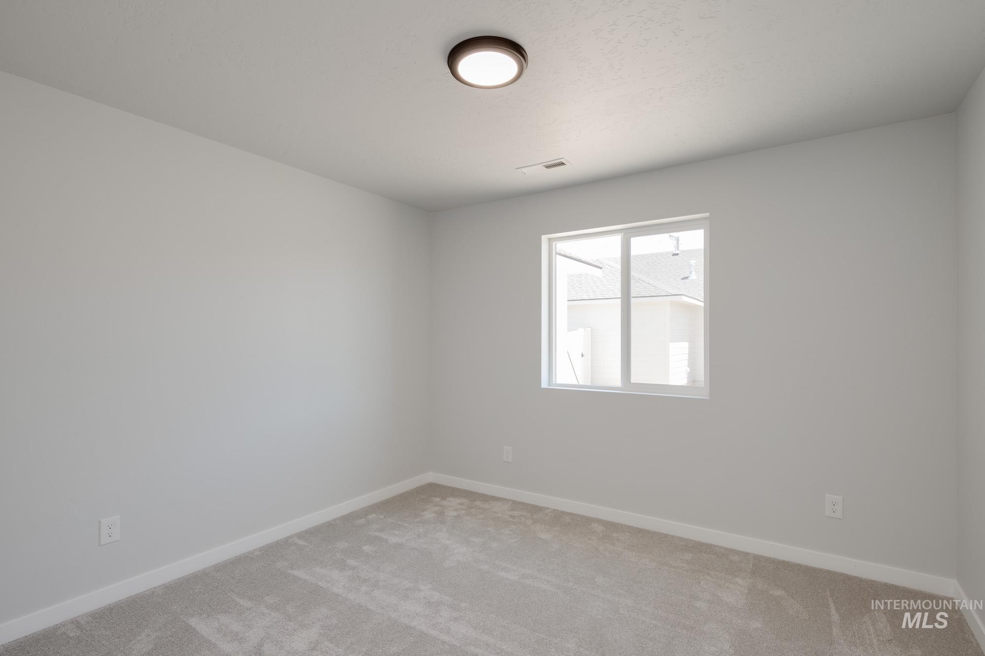 Empty room with light carpet