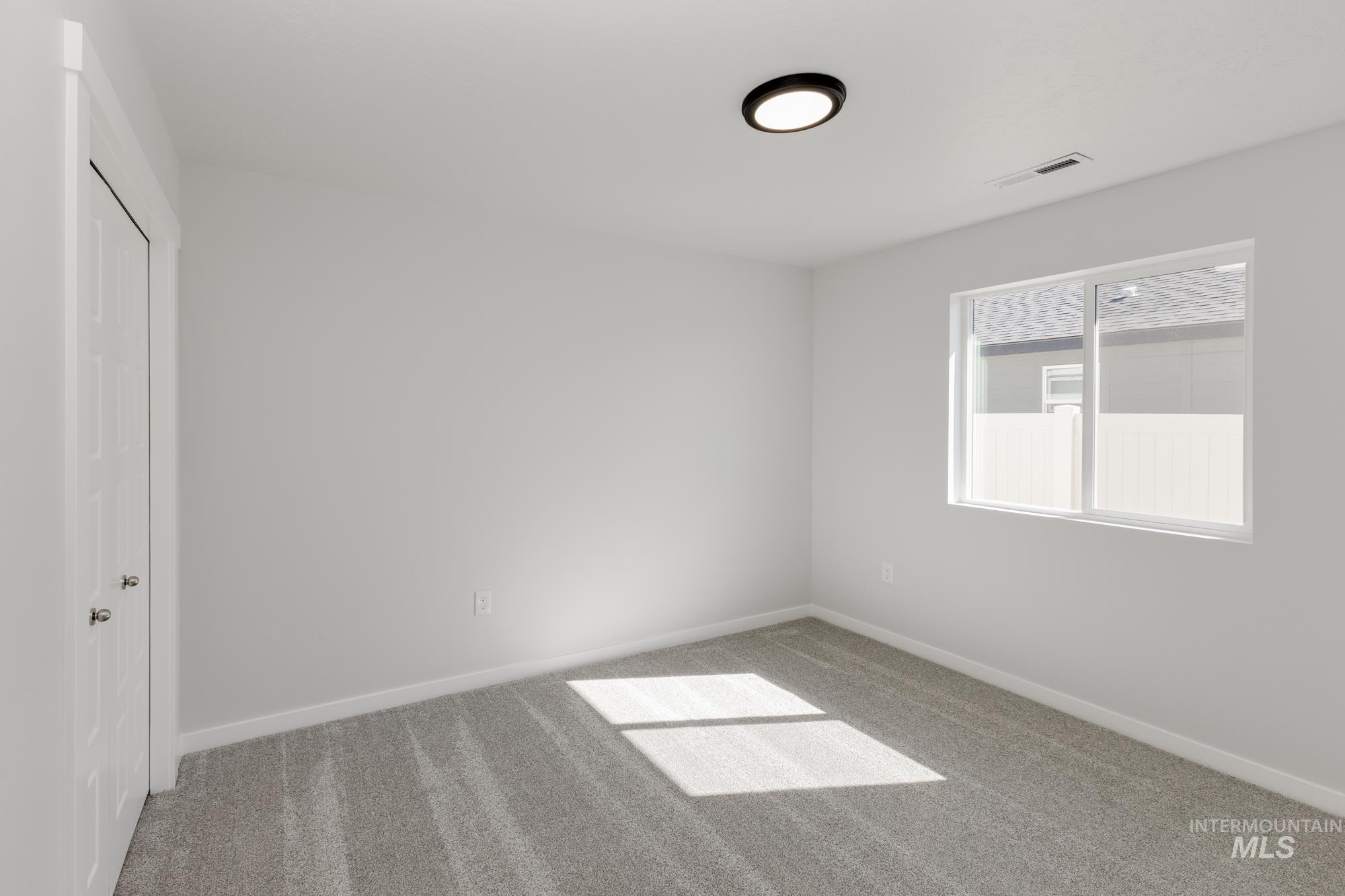Unfurnished bedroom featuring carpet floors and a closet