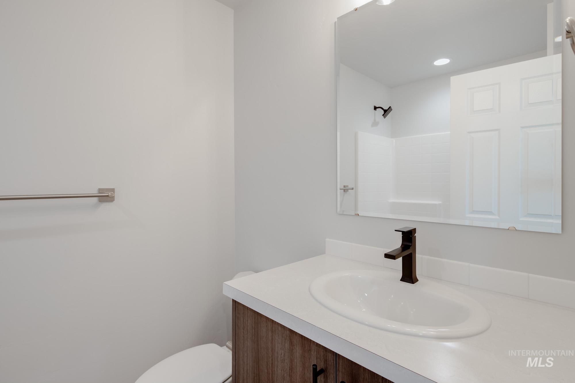 Bathroom with vanity and a shower
