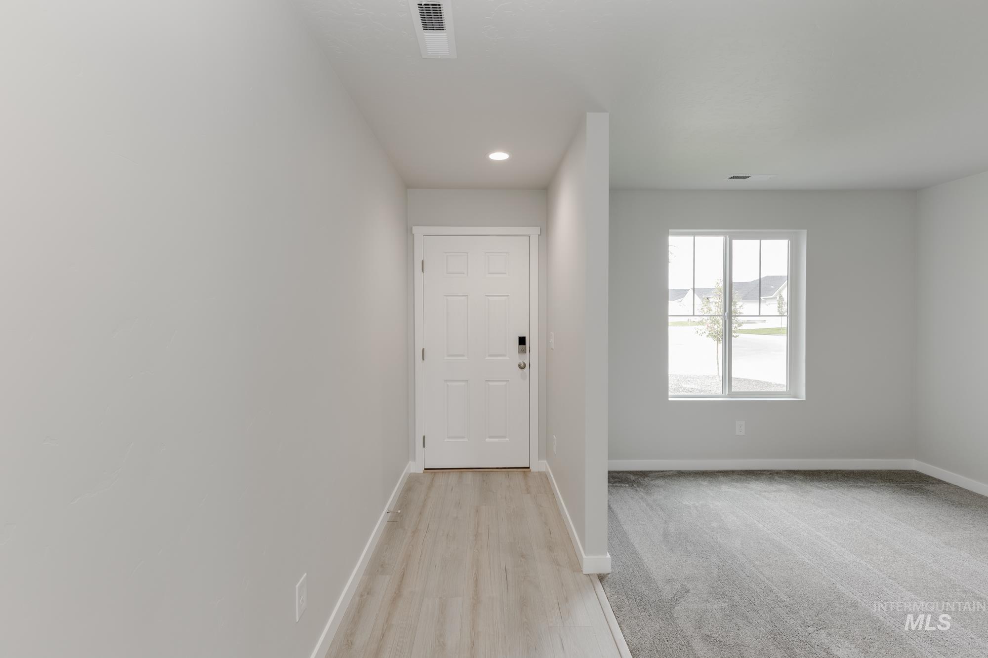 Hall featuring recessed lighting and light wood finished floors