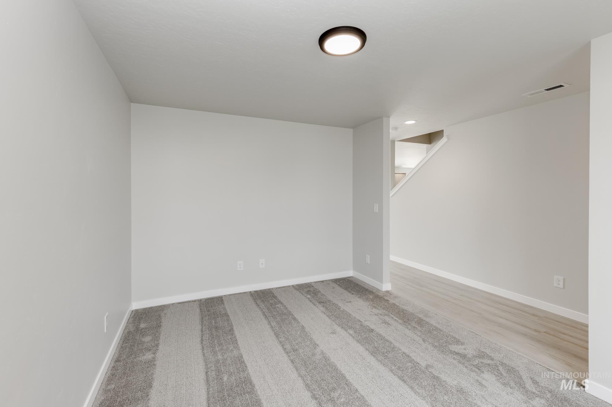 Below grade area with baseboards and carpet floors