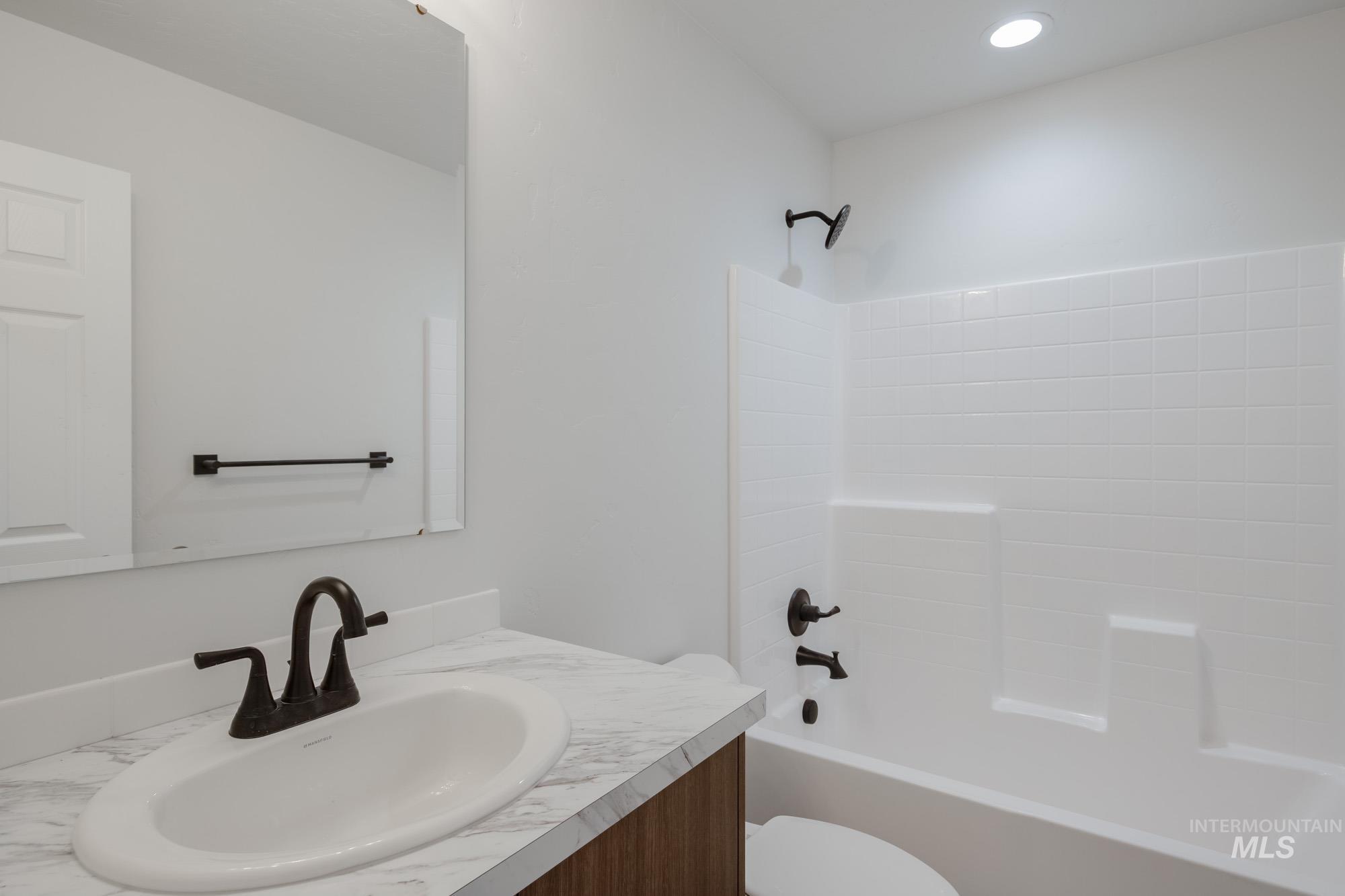 Full bathroom with tub / shower combination and vanity