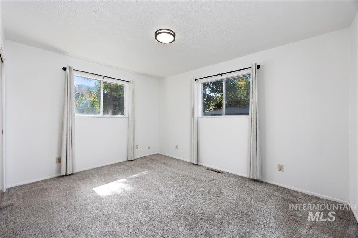 Empty room with carpet flooring