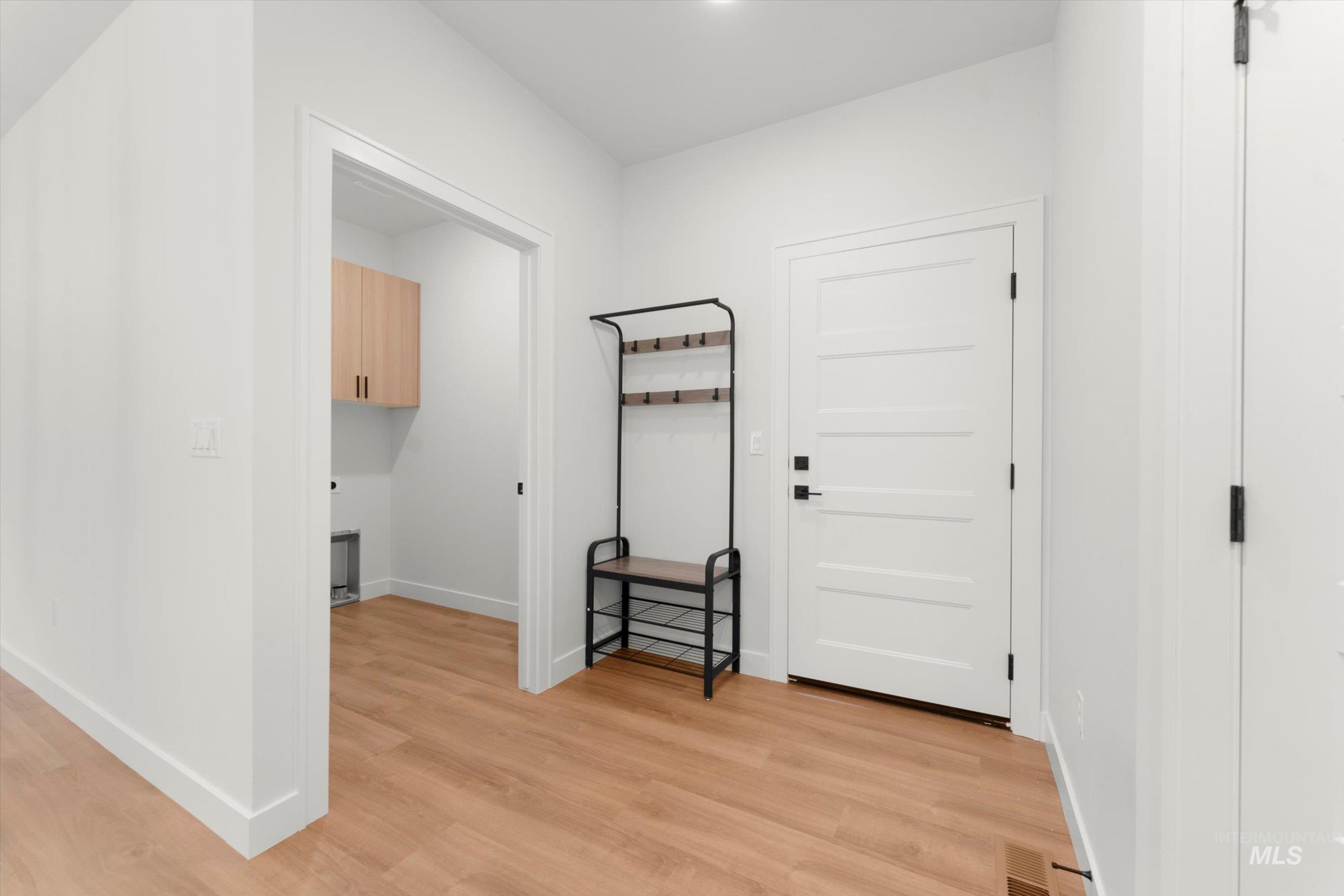 Washroom featuring light wood-type flooring