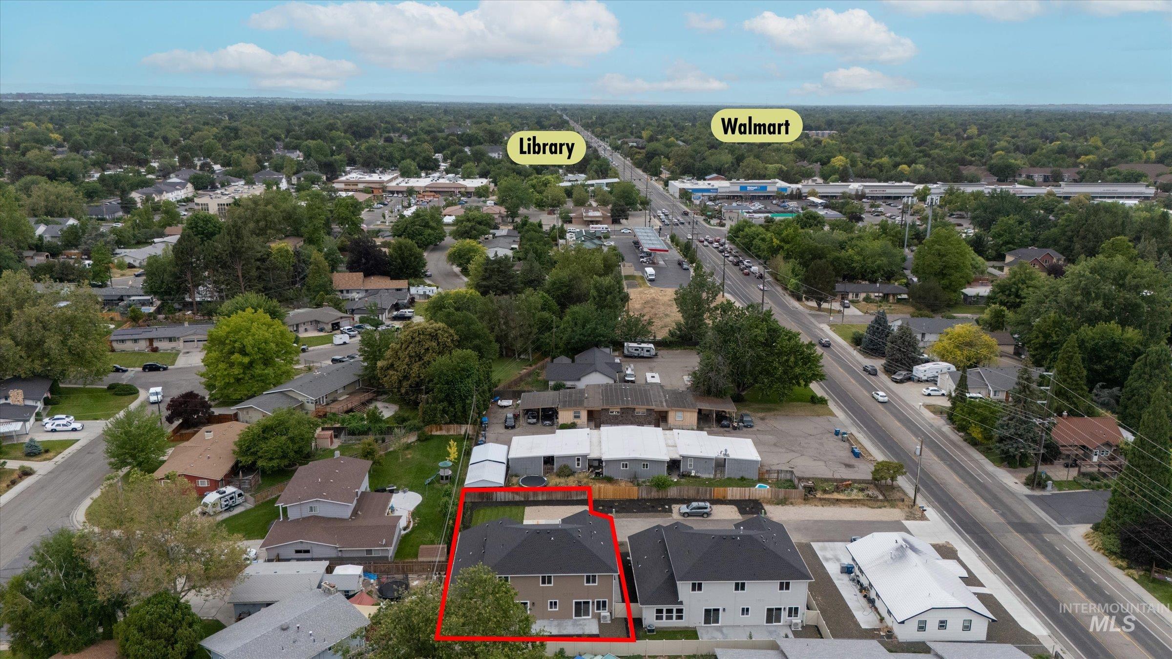 Aerial view of residential area with property parcel outlined