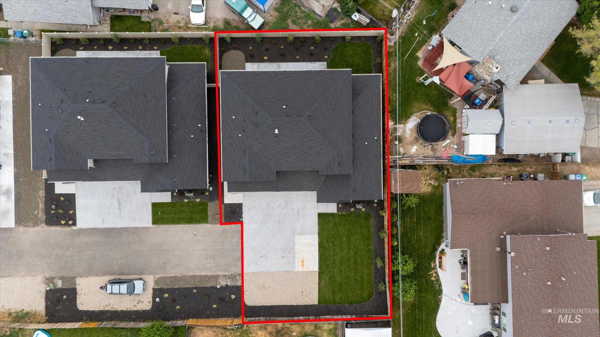 Aerial perspective of suburban area featuring property parcel outlined