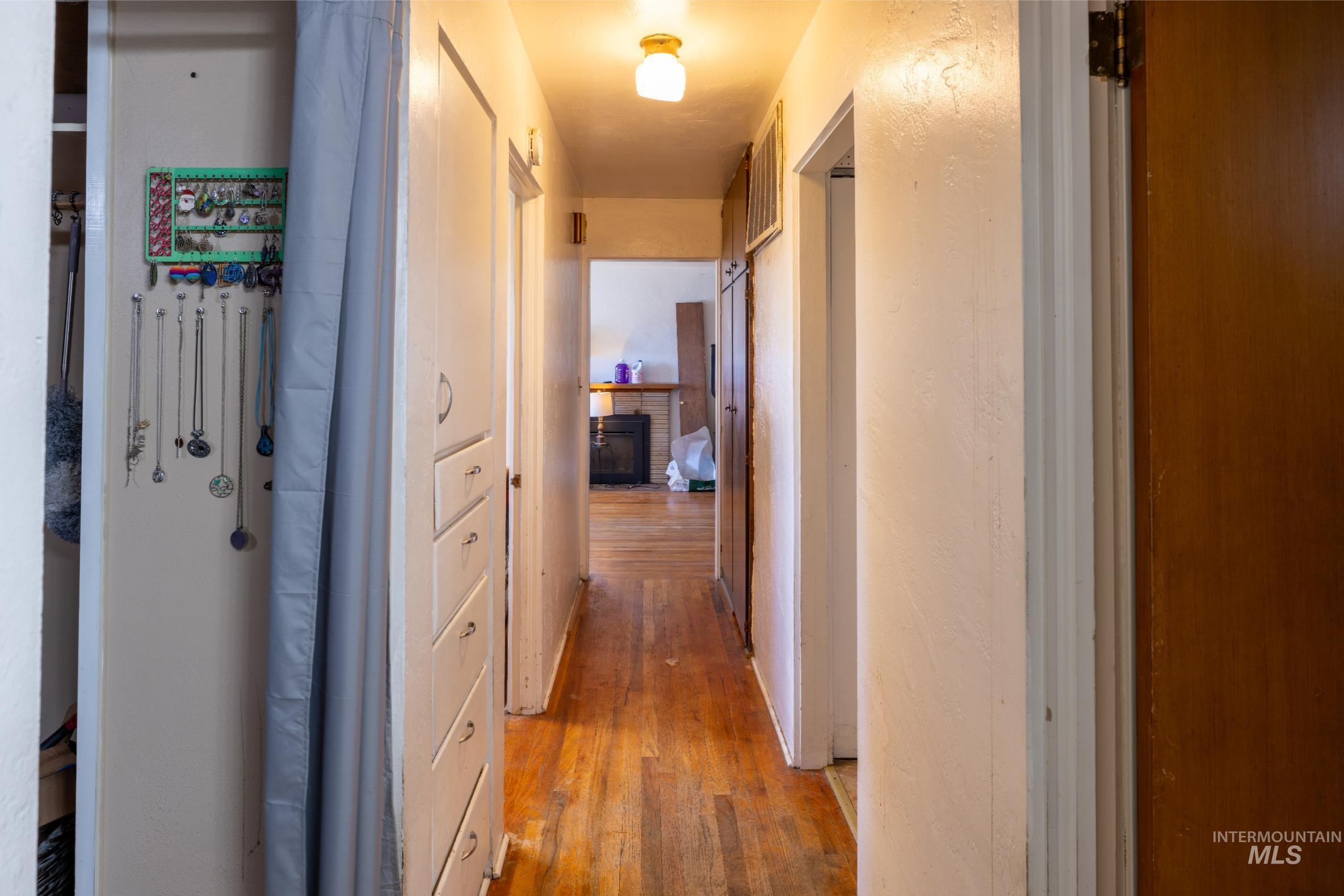 Hallway featuring light wood finished floors