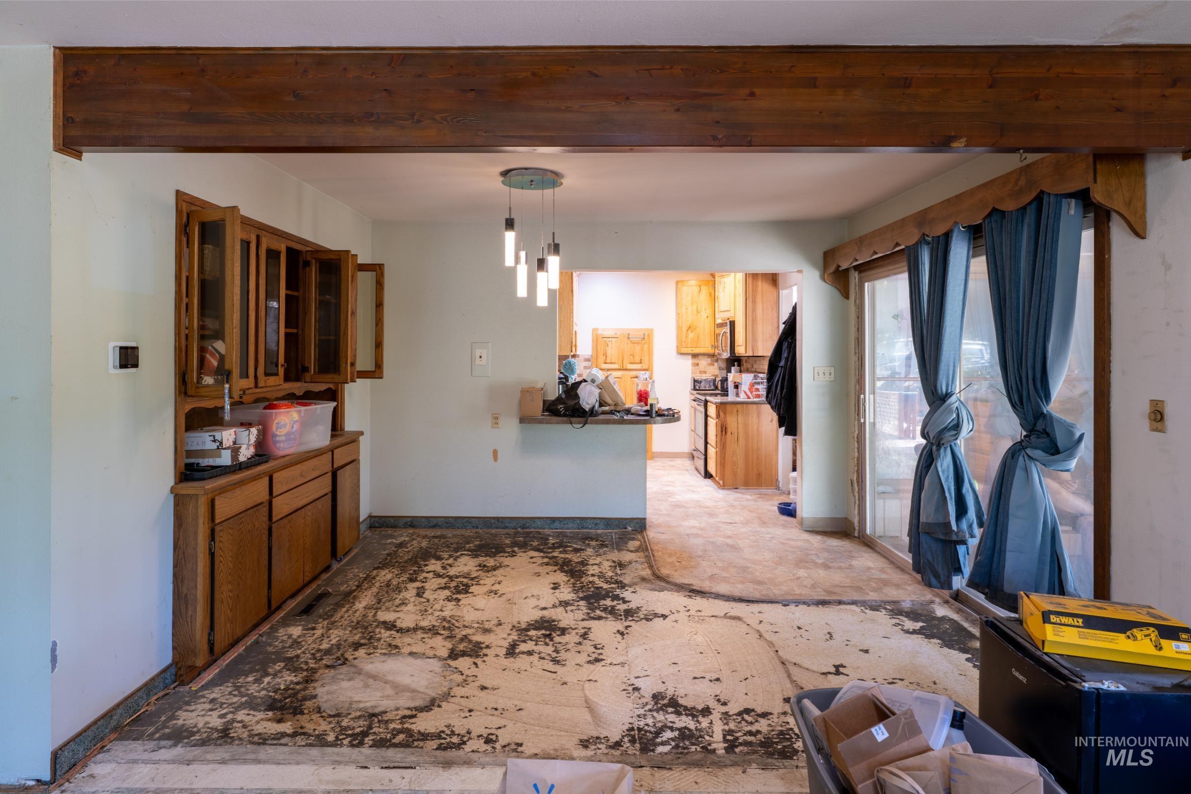 Living area featuring beam ceiling