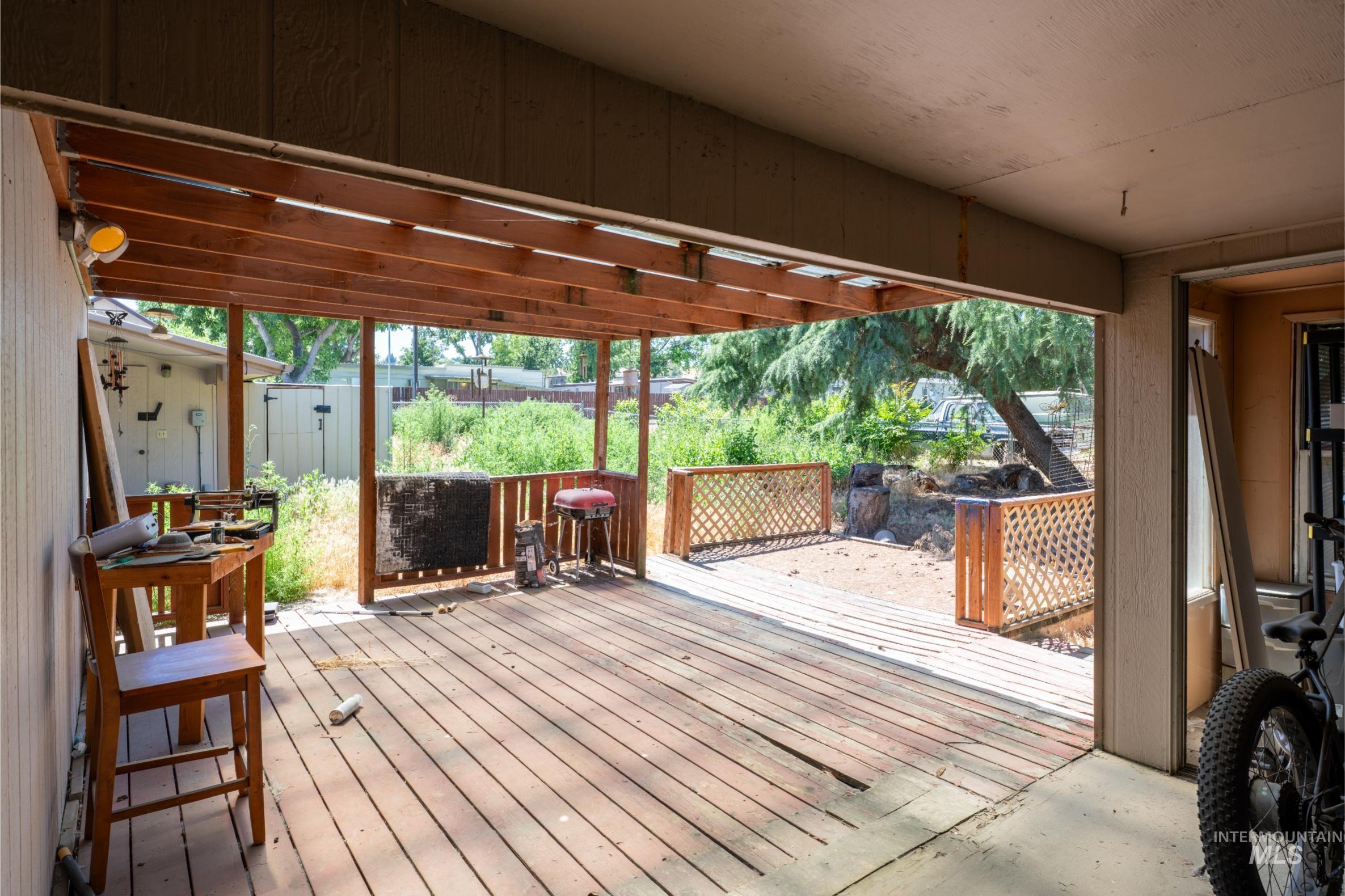 Wooden terrace featuring grilling area