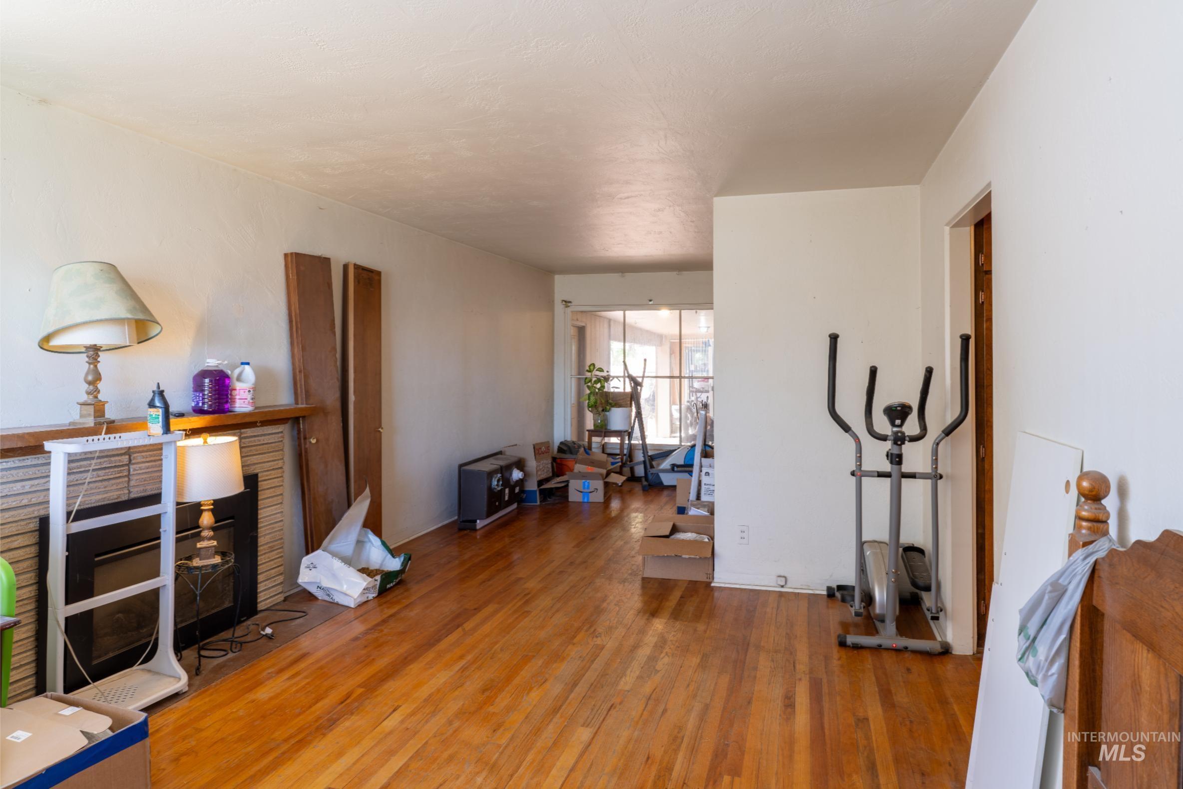 Workout area featuring hardwood / wood-style floors