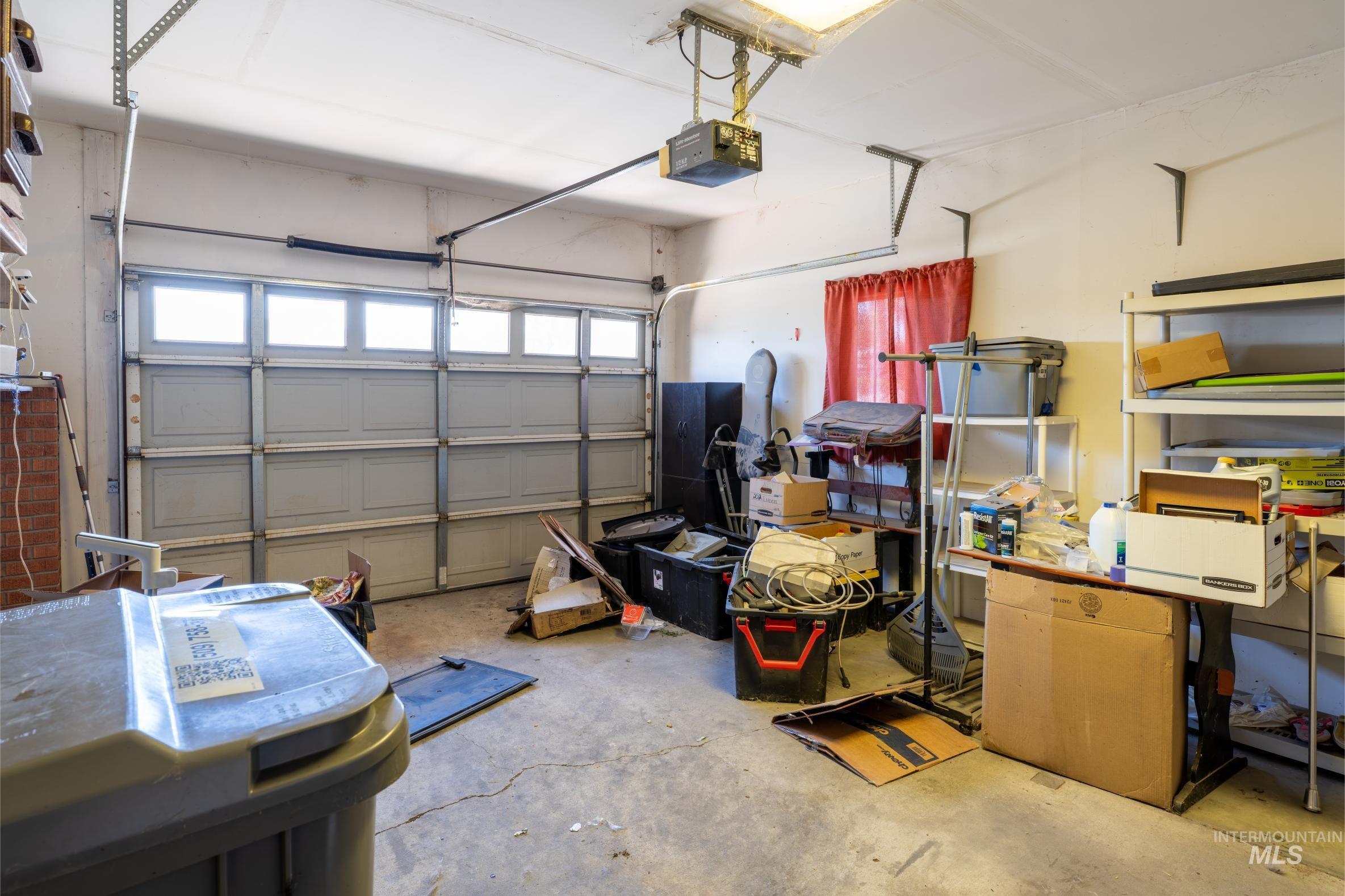 Garage featuring a garage door opener