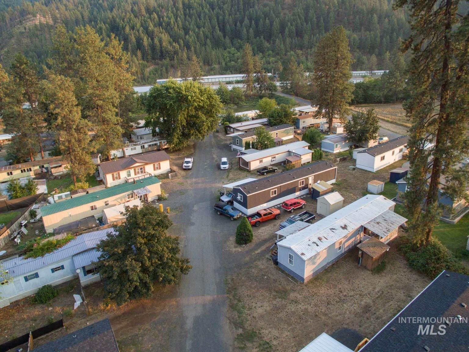 Aerial view of residential area featuring a forest