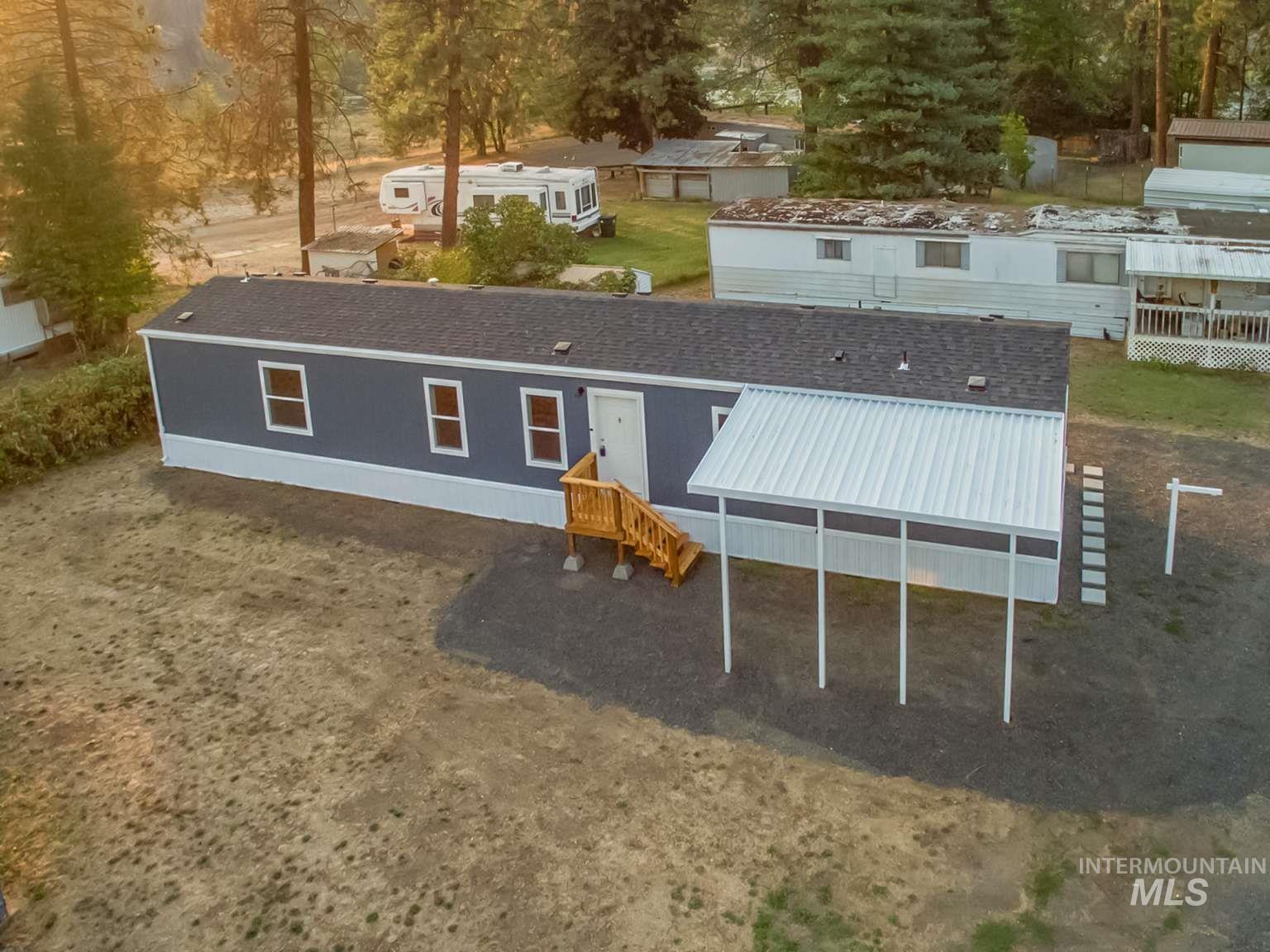 View of front of home featuring a shingled roof