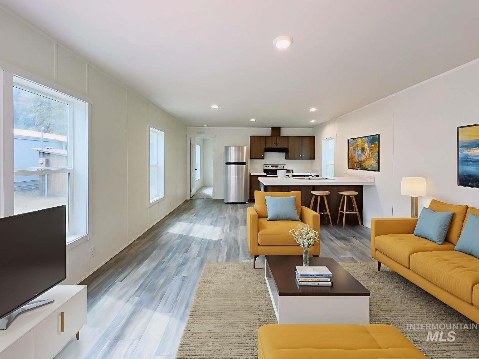 Living area featuring recessed lighting and light wood-style flooring