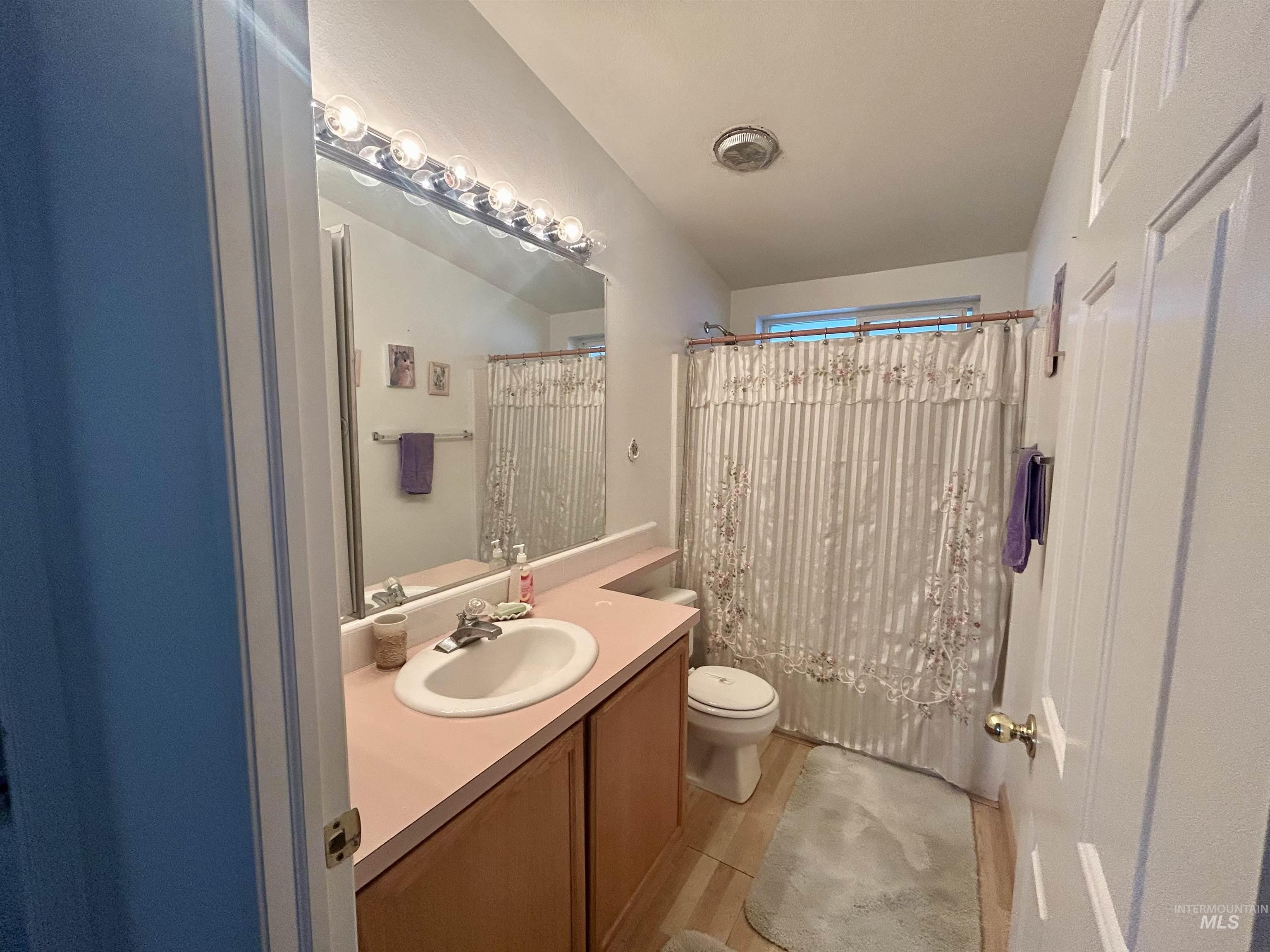 Bathroom with vanity and shower / bath combo