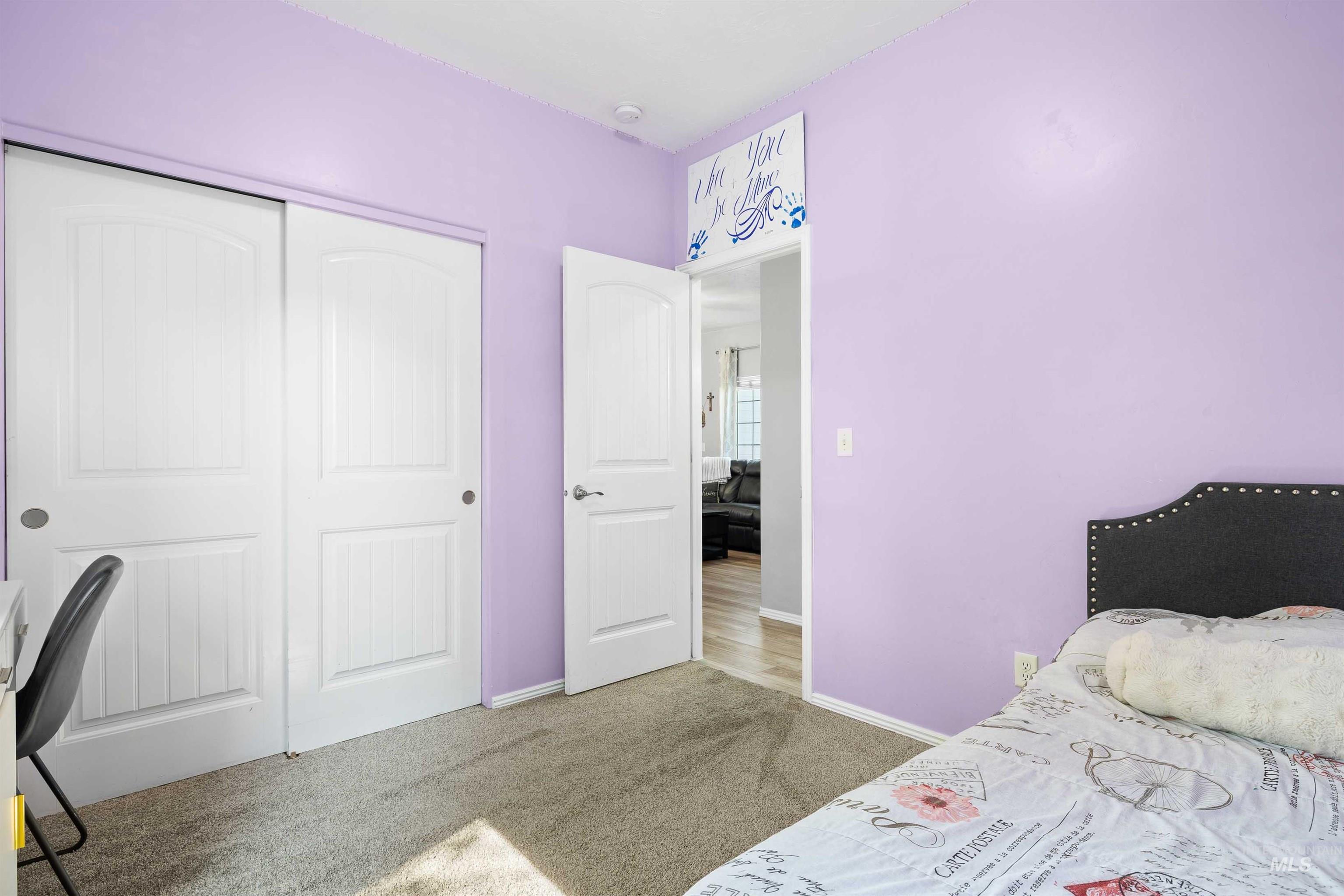 Bedroom with carpet flooring and a closet