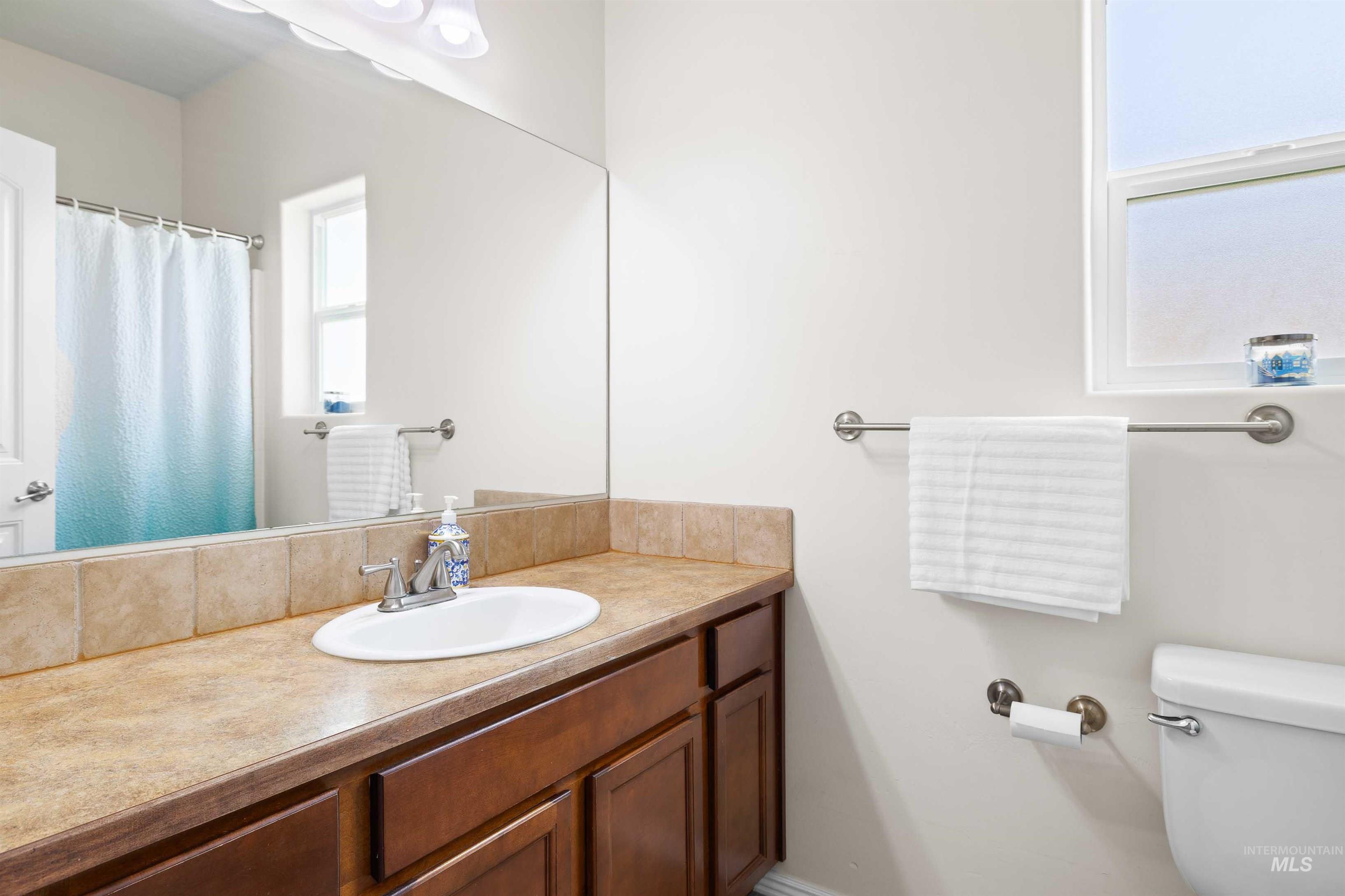 Bathroom with toilet and vanity