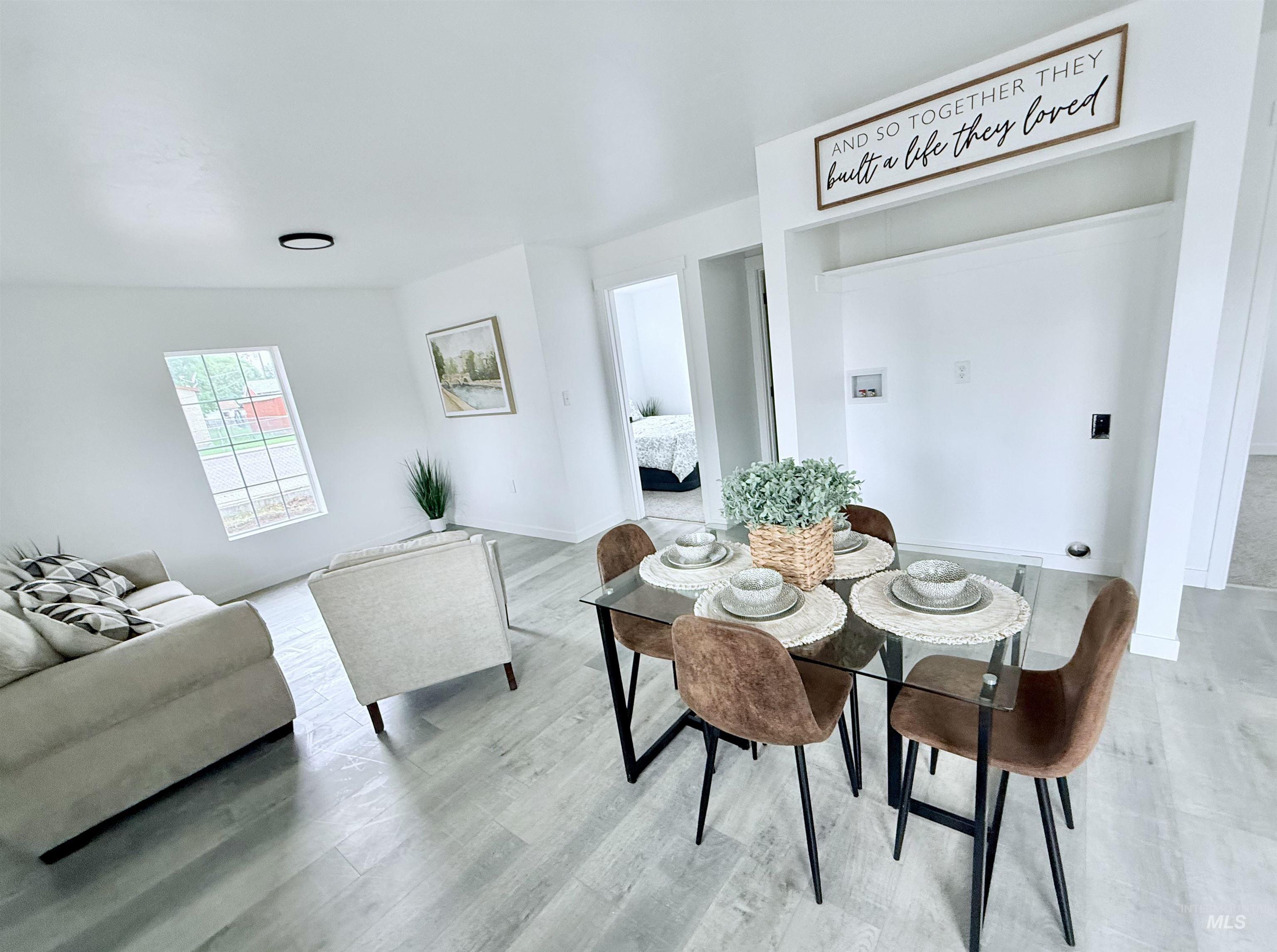 Dining space featuring wood finished floors and baseboards