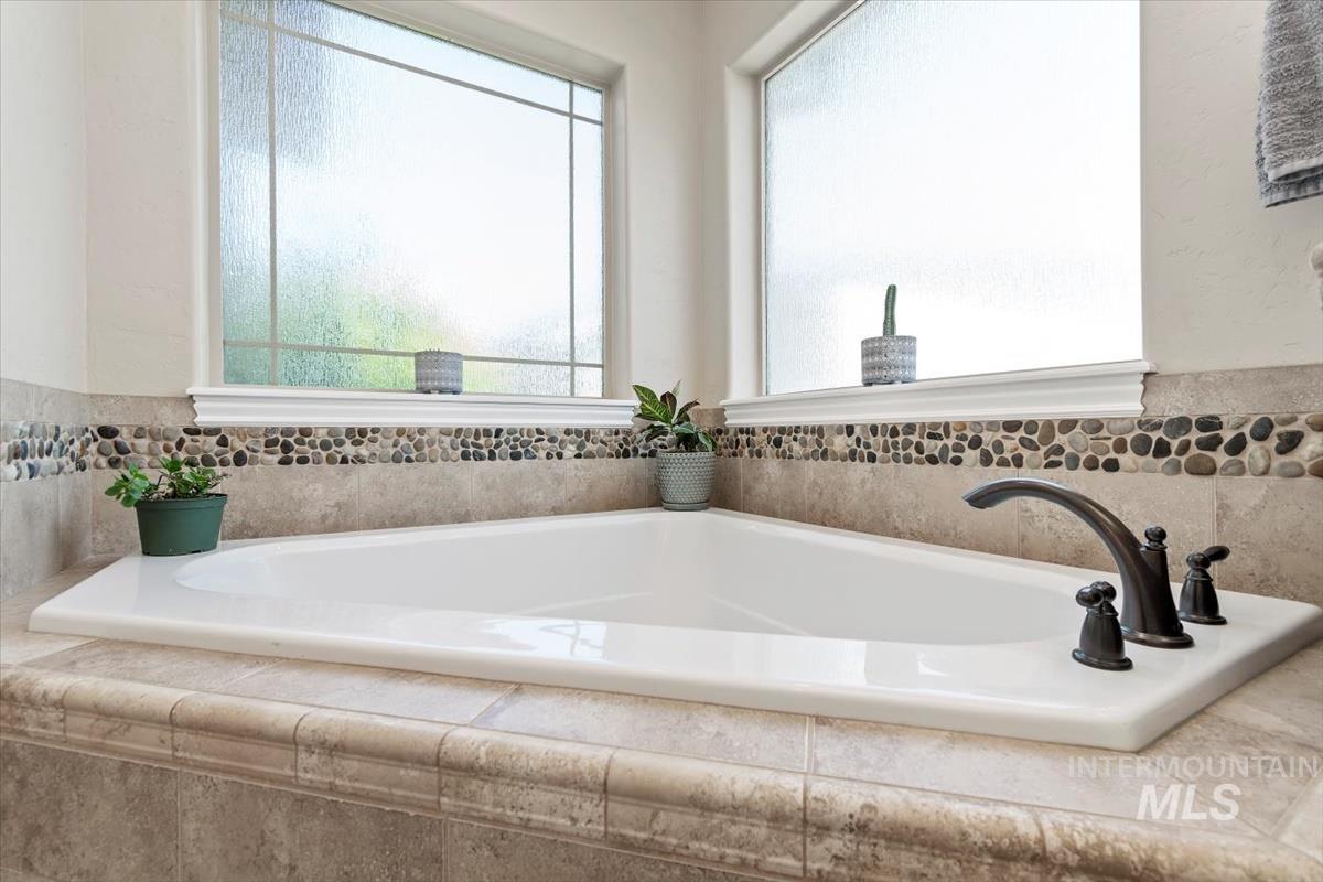 Full bathroom with a garden tub
