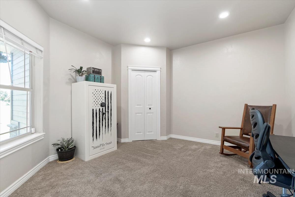 Sitting room featuring light colored carpet and recessed lighting