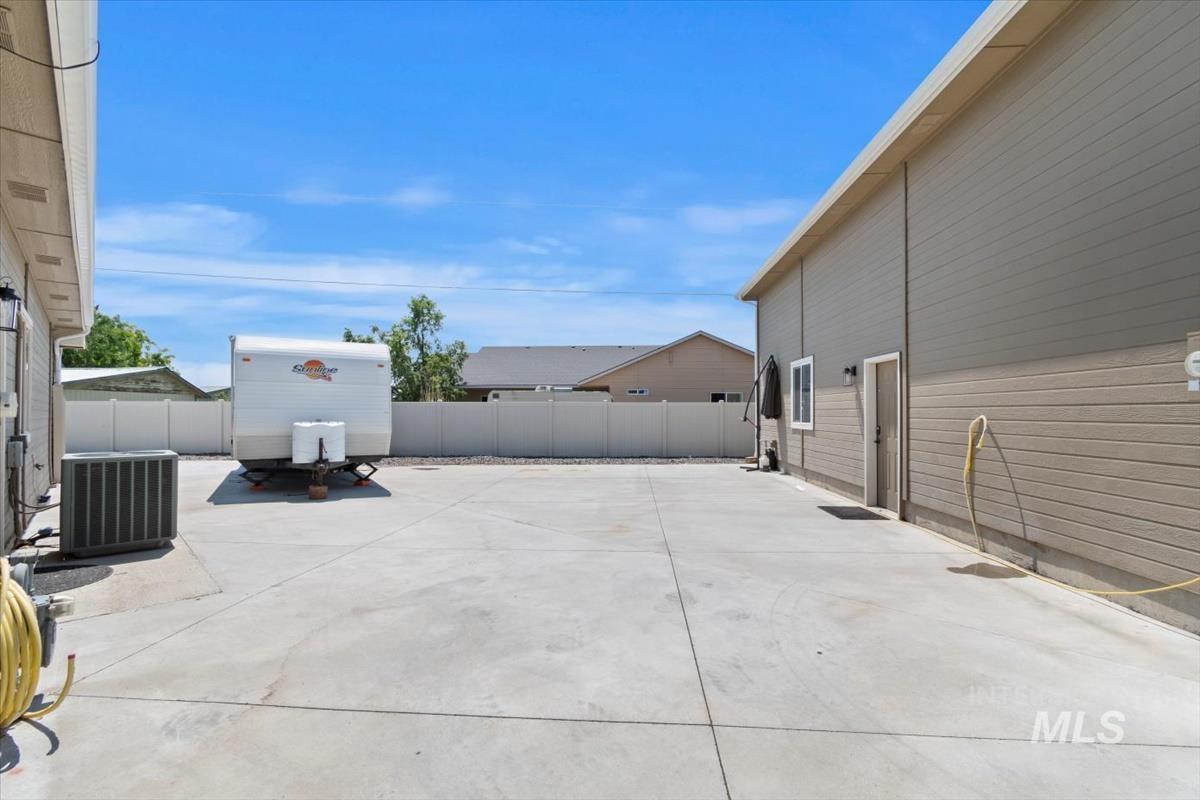 View of fenced backyard