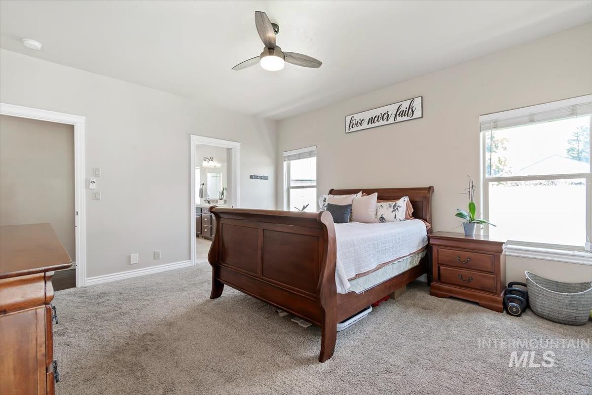 Bedroom featuring carpet and ceiling fan
