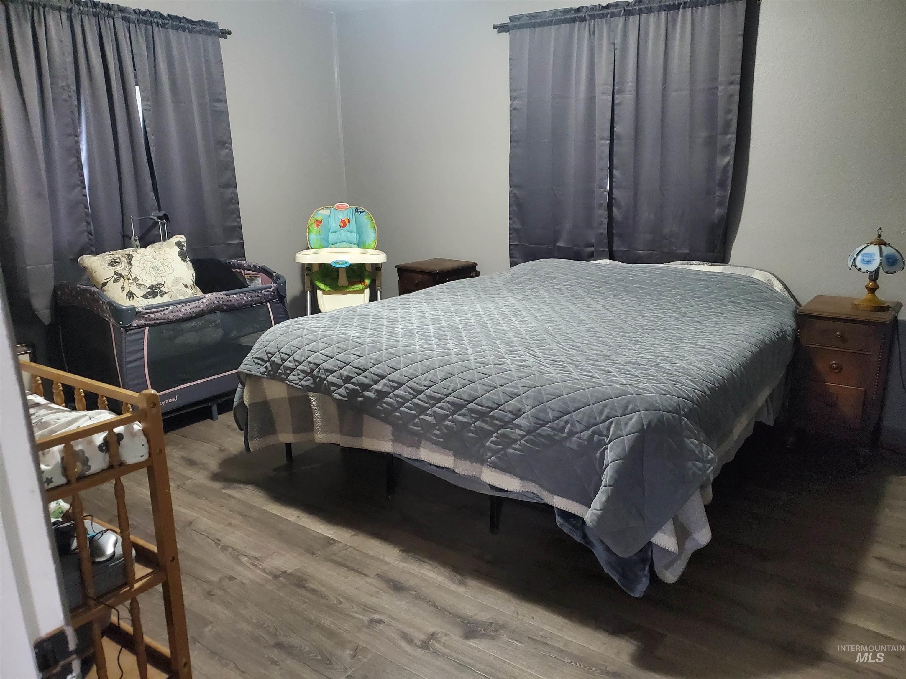 Bedroom with wood finished floors