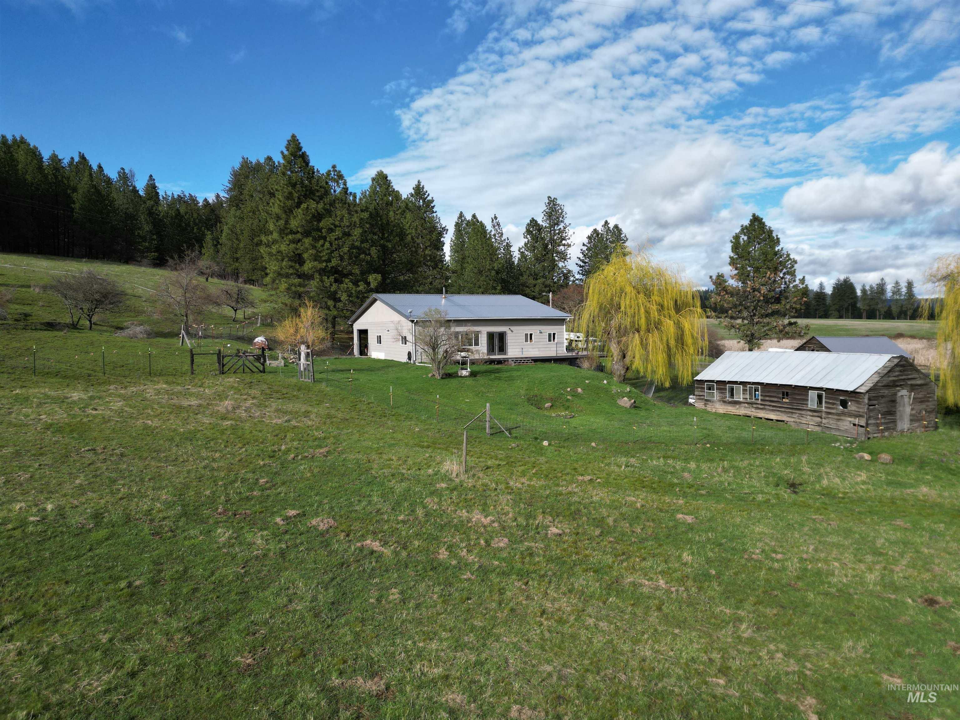 View of yard with a view of rural / pastoral area and an outdoor structure