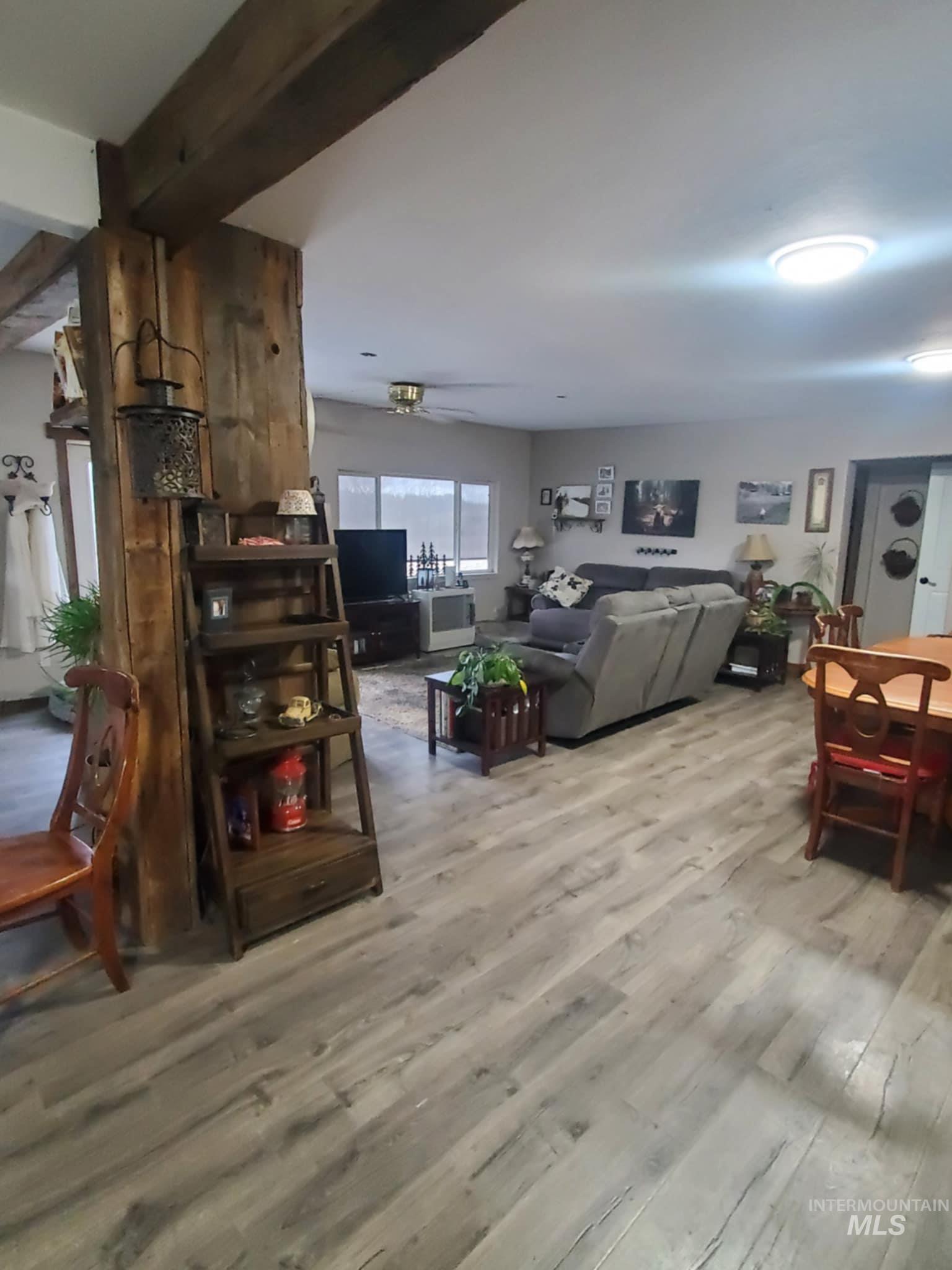 Living room with light wood-style flooring