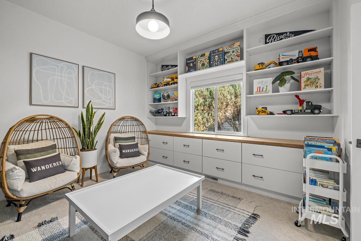 Rec room with light carpet