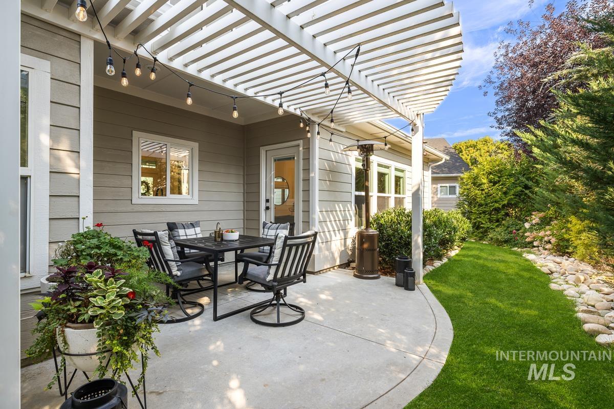 View of patio / terrace featuring a pergola and outdoor dining space