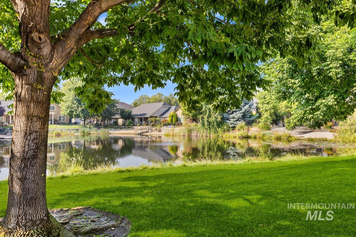 View of green lawn with a water view